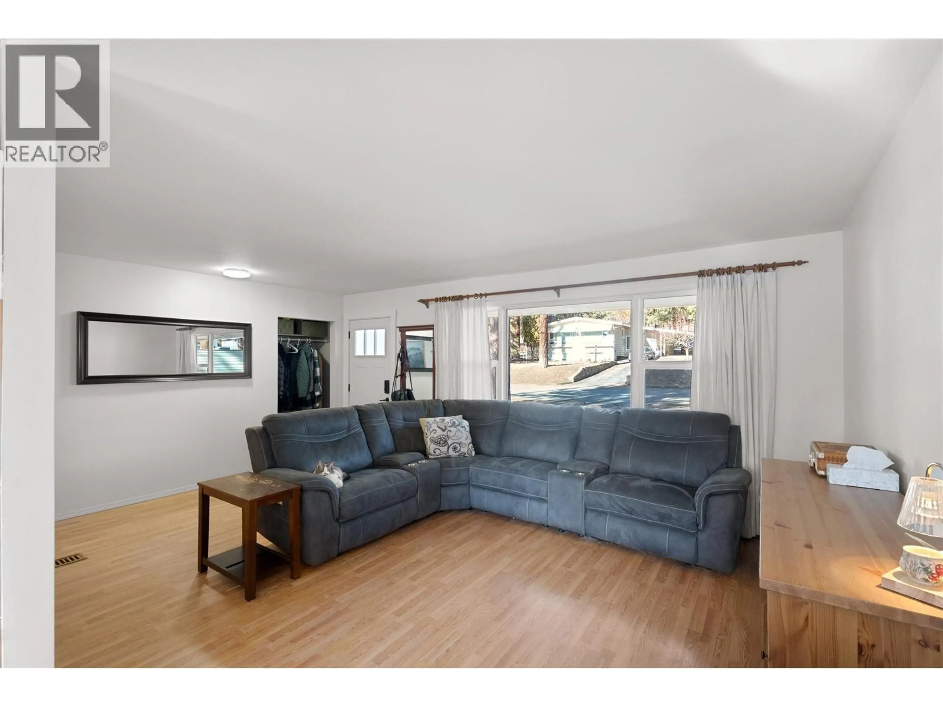 Living room with furniture, wood/laminate floor for 2064 CASTILLOU CRESCENT, Merritt British Columbia V1K1H8