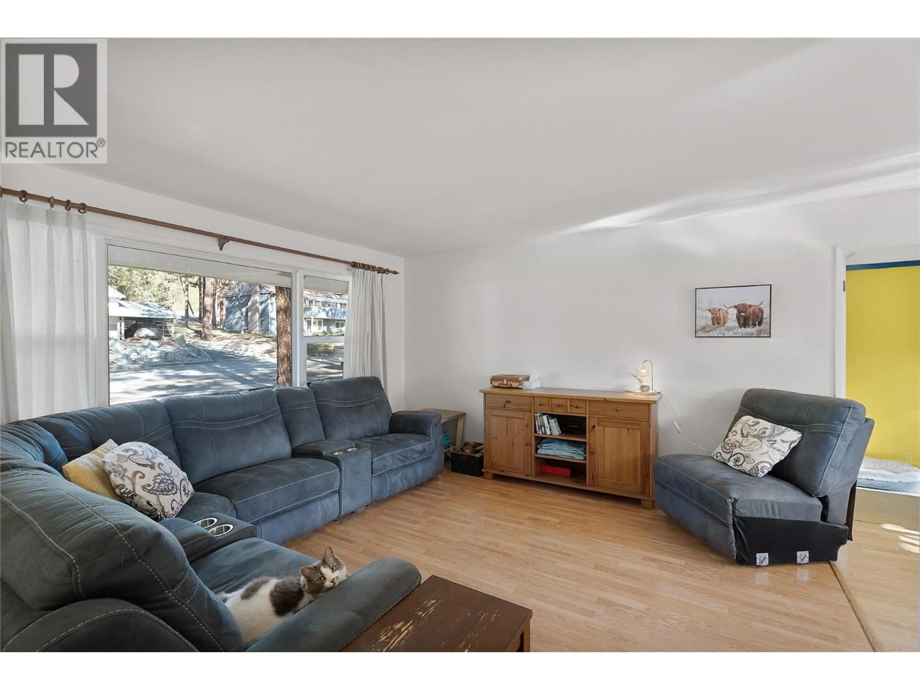 Living room with furniture, wood/laminate floor for 2064 CASTILLOU CRESCENT, Merritt British Columbia V1K1H8