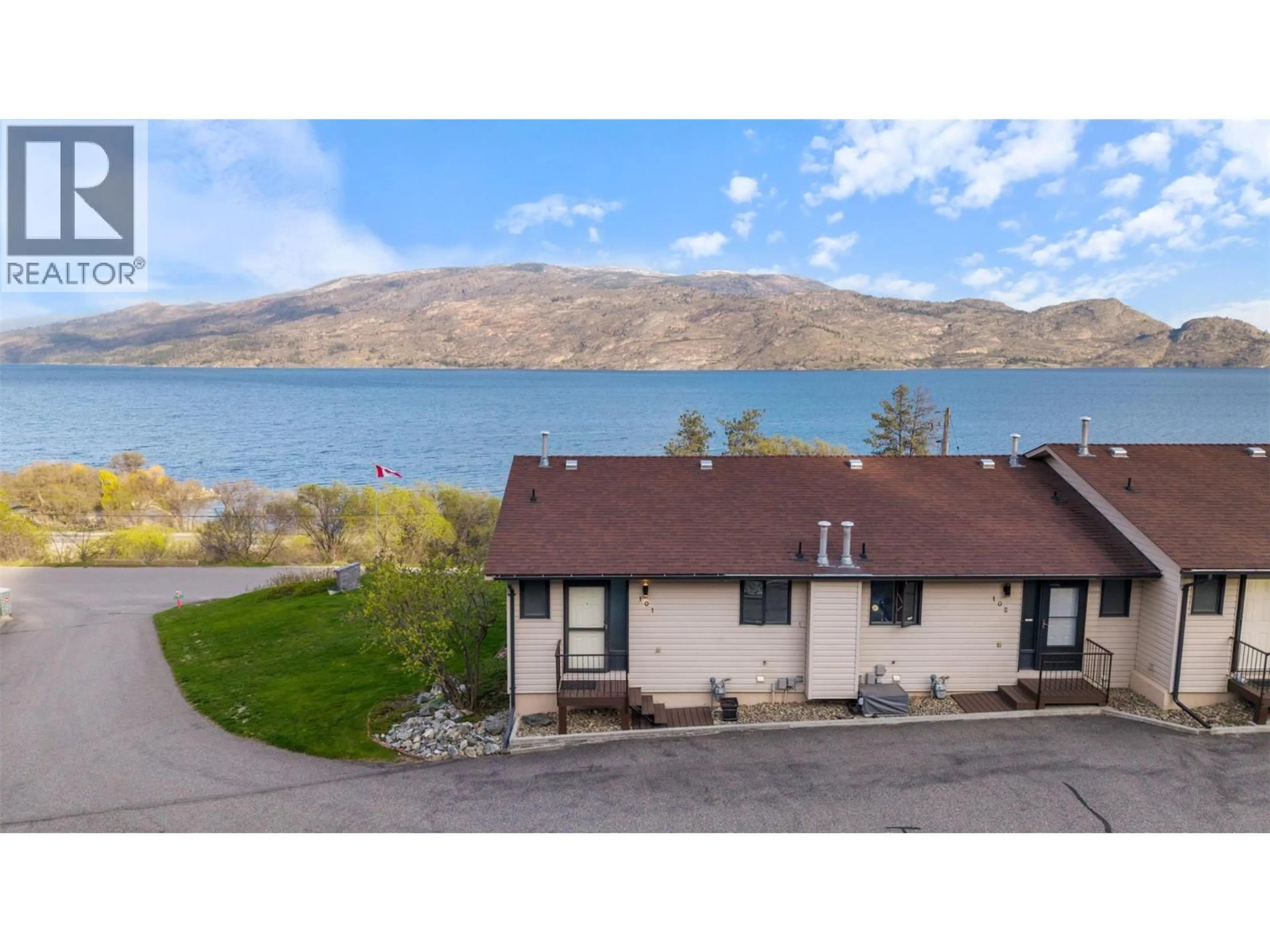A pic from outside/outdoor area/front of a property/back of a property/a pic from drone, water/lake/river/ocean view for 101 - 5970 PRINCESS STREET, Peachland British Columbia V0H1X7