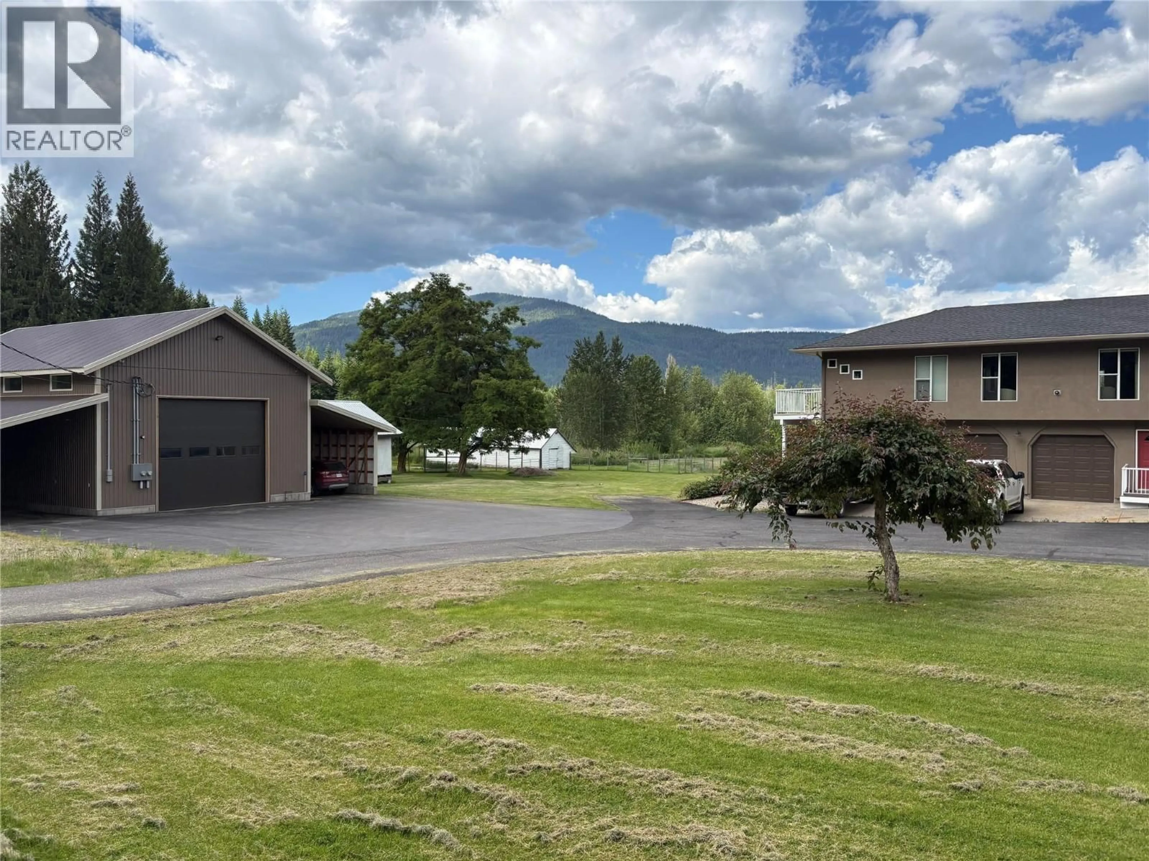 A pic from outside/outdoor area/front of a property/back of a property/a pic from drone, mountain view for 1851 70 STREET SOUTHEAST, Salmon Arm British Columbia V1E1X4