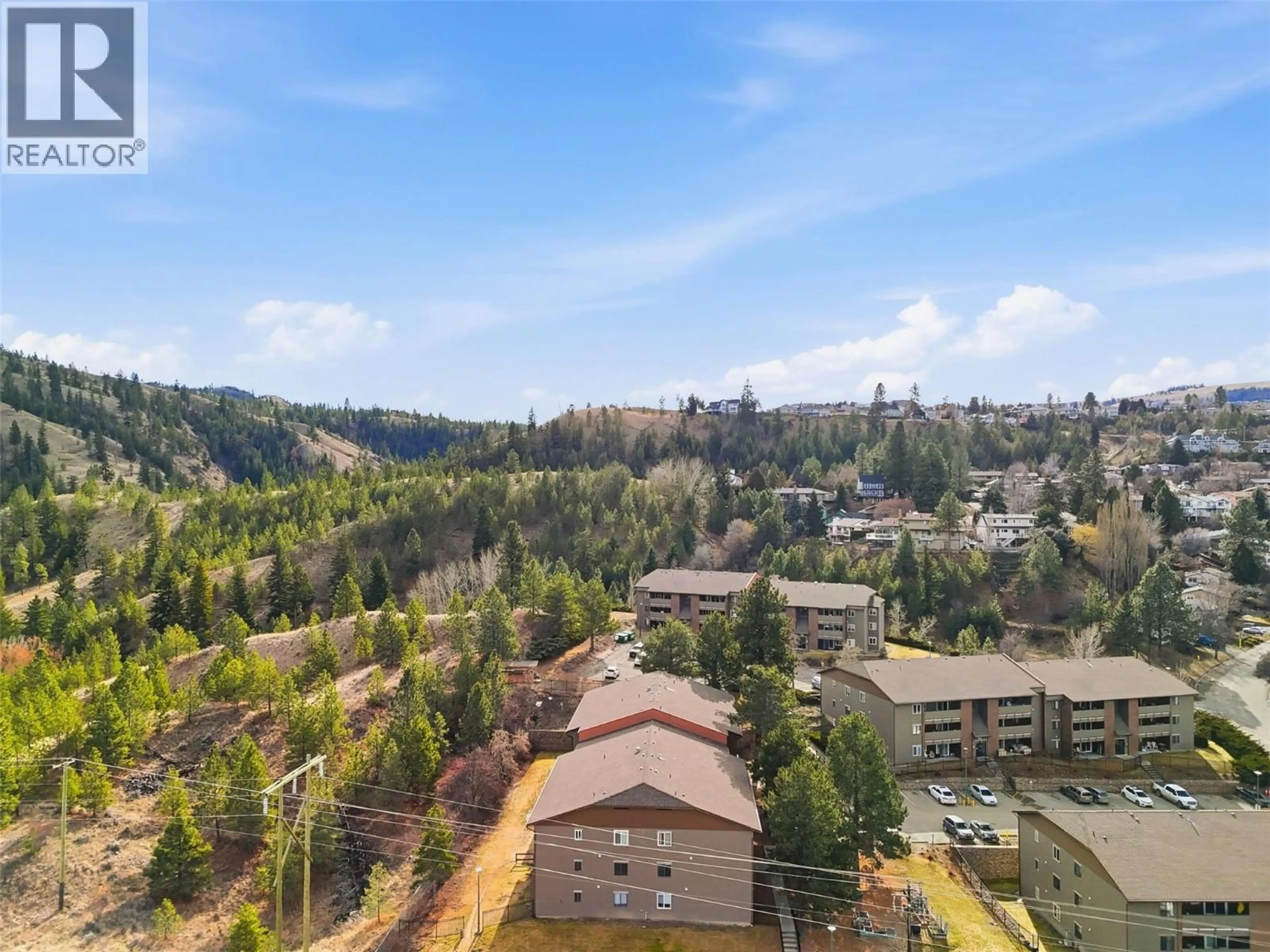 A pic from outside/outdoor area/front of a property/back of a property/a pic from drone, forest/trees view for 306 - 44 WHITESHIELD CRESCENT SOUTH, Kamloops British Columbia V2E2J1