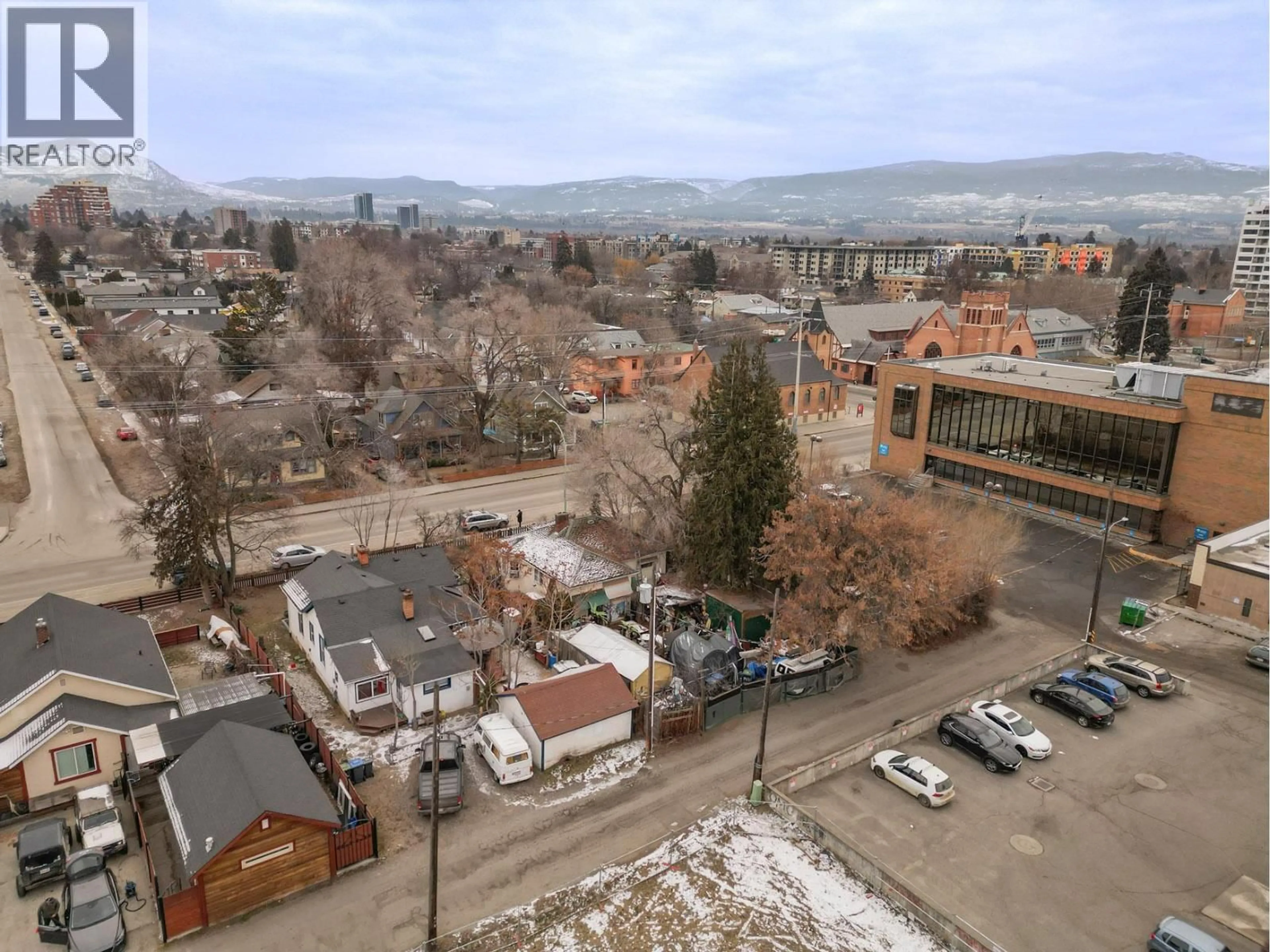 A pic from outside/outdoor area/front of a property/back of a property/a pic from drone, mountain view for 1470 RICHTER STREET, Kelowna British Columbia V1Y2L8
