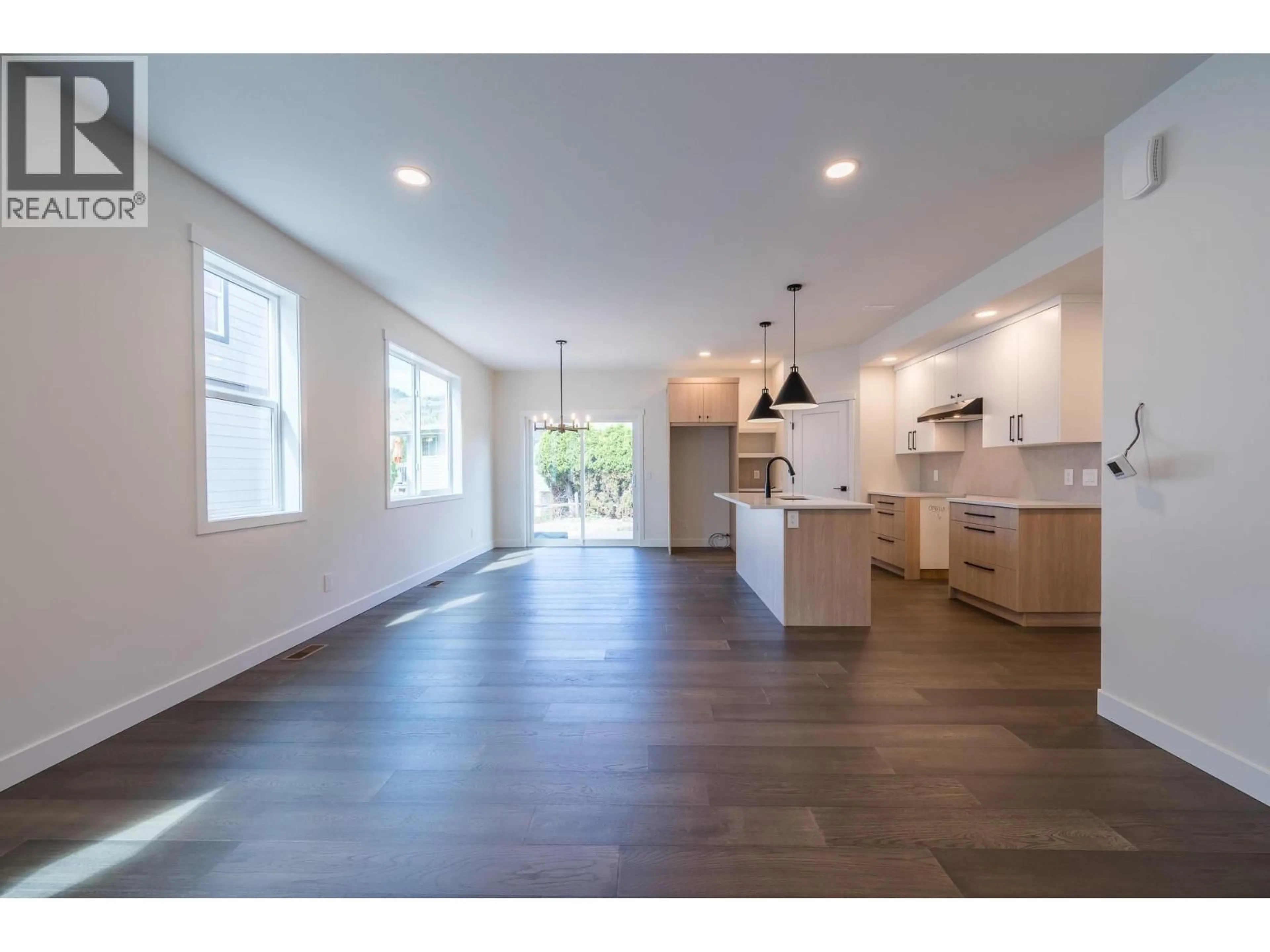 Open concept kitchen, wood/laminate floor for 723 LYNE ROAD, Kamloops British Columbia V2B6Z7