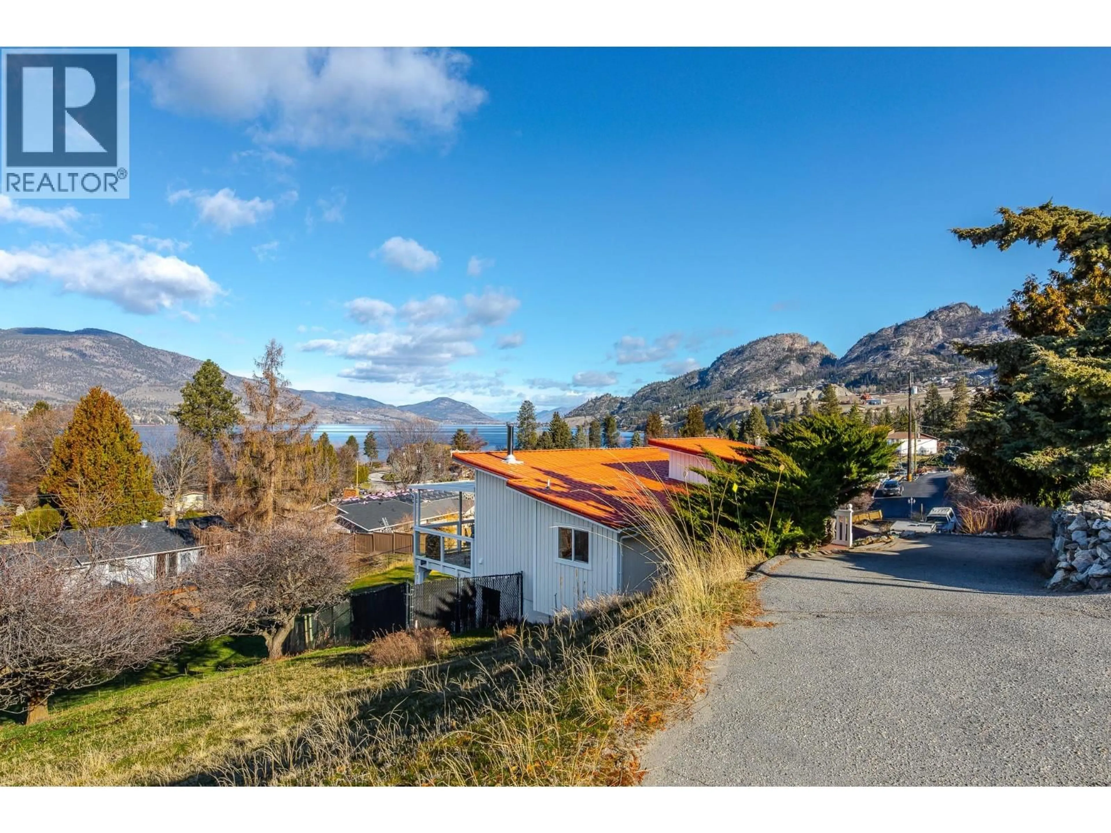 A pic from outside/outdoor area/front of a property/back of a property/a pic from drone, mountain view for 334 CARMEL CRESCENT, Okanagan Falls British Columbia V0H1R5