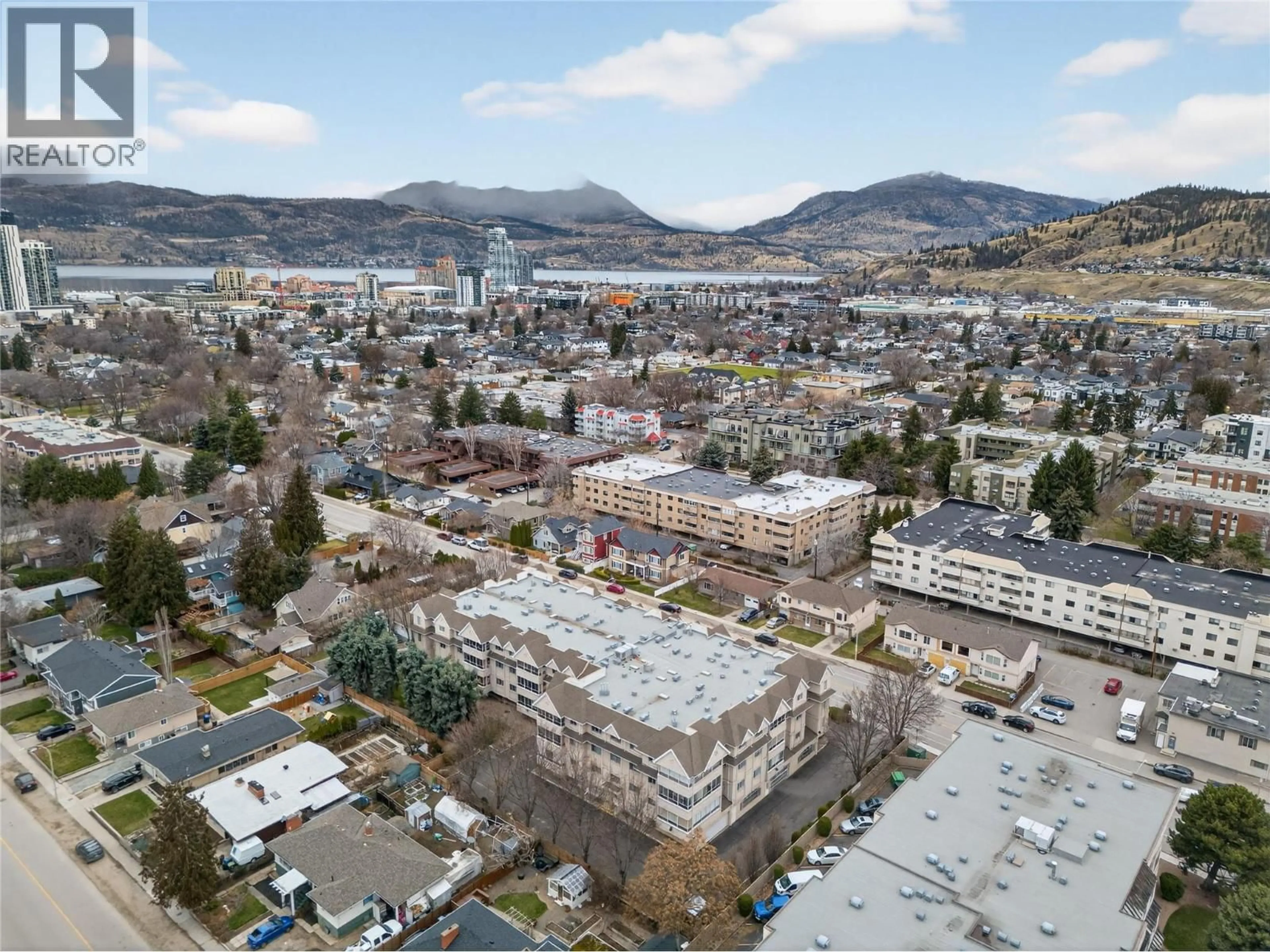 A pic from outside/outdoor area/front of a property/back of a property/a pic from drone, mountain view for 101 - 1055 LAWRENCE AVENUE, Kelowna British Columbia V1Y6M3
