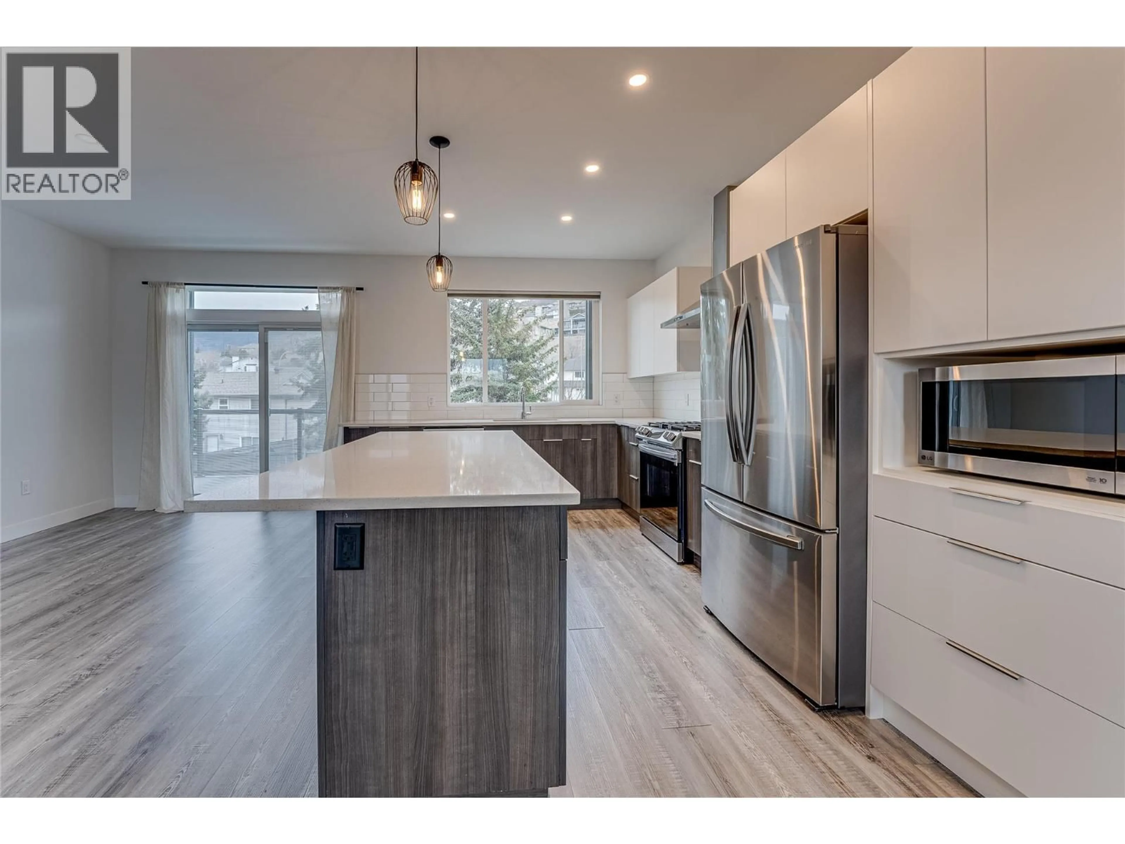 Open concept kitchen, wood/laminate floor for 11 - 1039 MT. FOSTHALL DRIVE, Vernon British Columbia V1B2W2