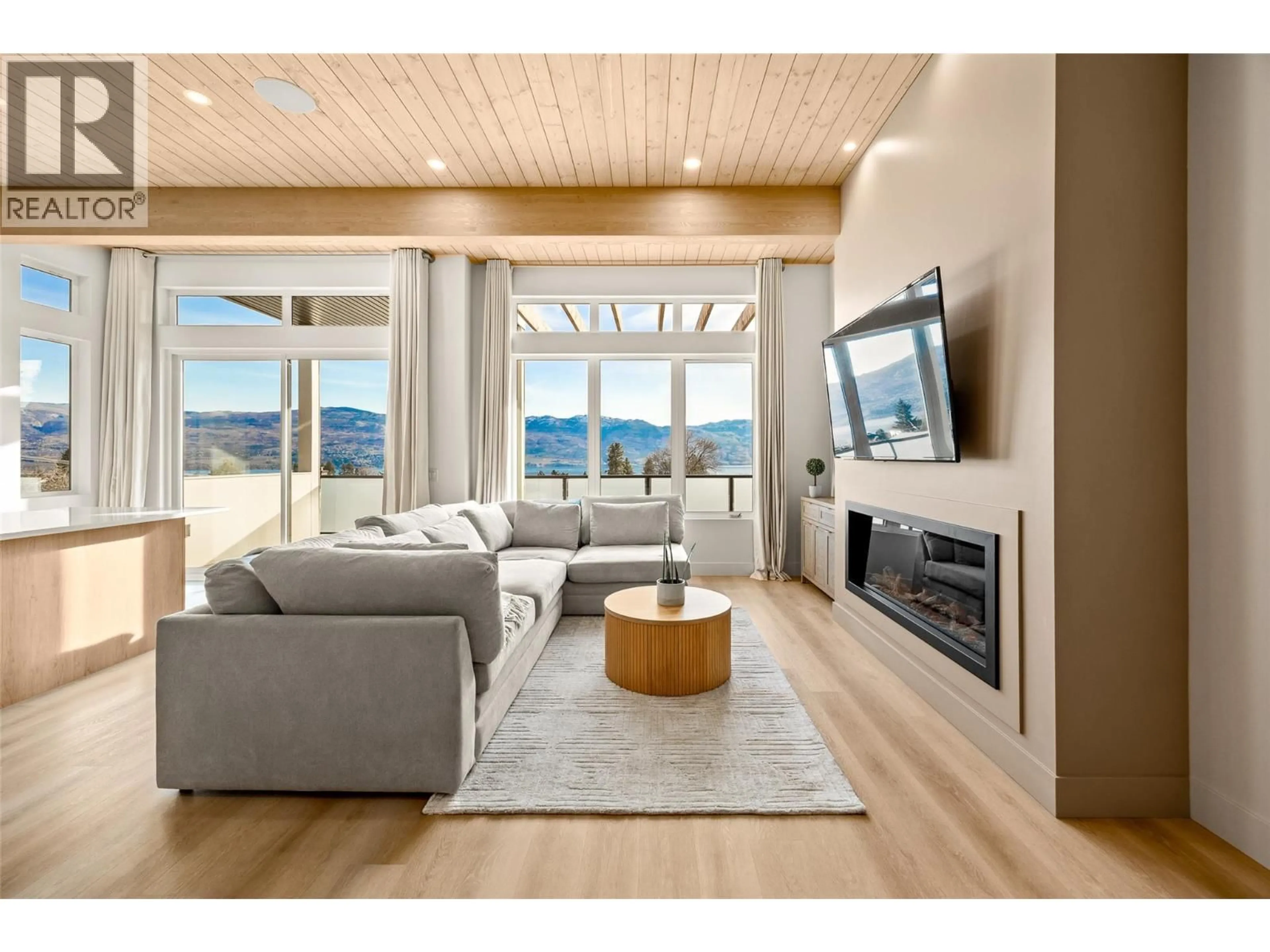 Living room with furniture, wood/laminate floor for 1027 KITSON COURT, West Kelowna British Columbia V1Z0B9