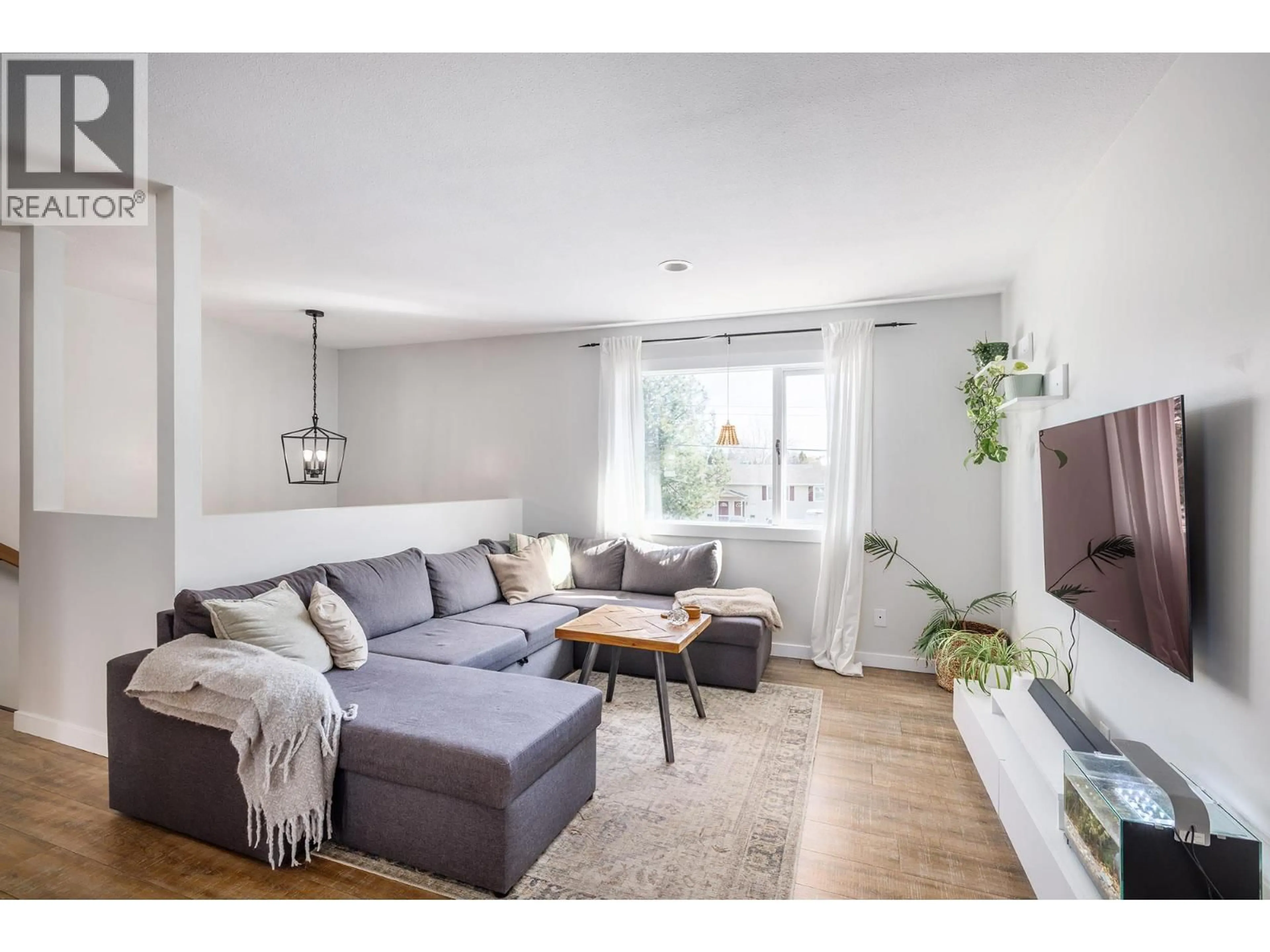 Living room with furniture, wood/laminate floor for 2728 RIFFINGTON PLACE, West Kelowna British Columbia V1Z3L1