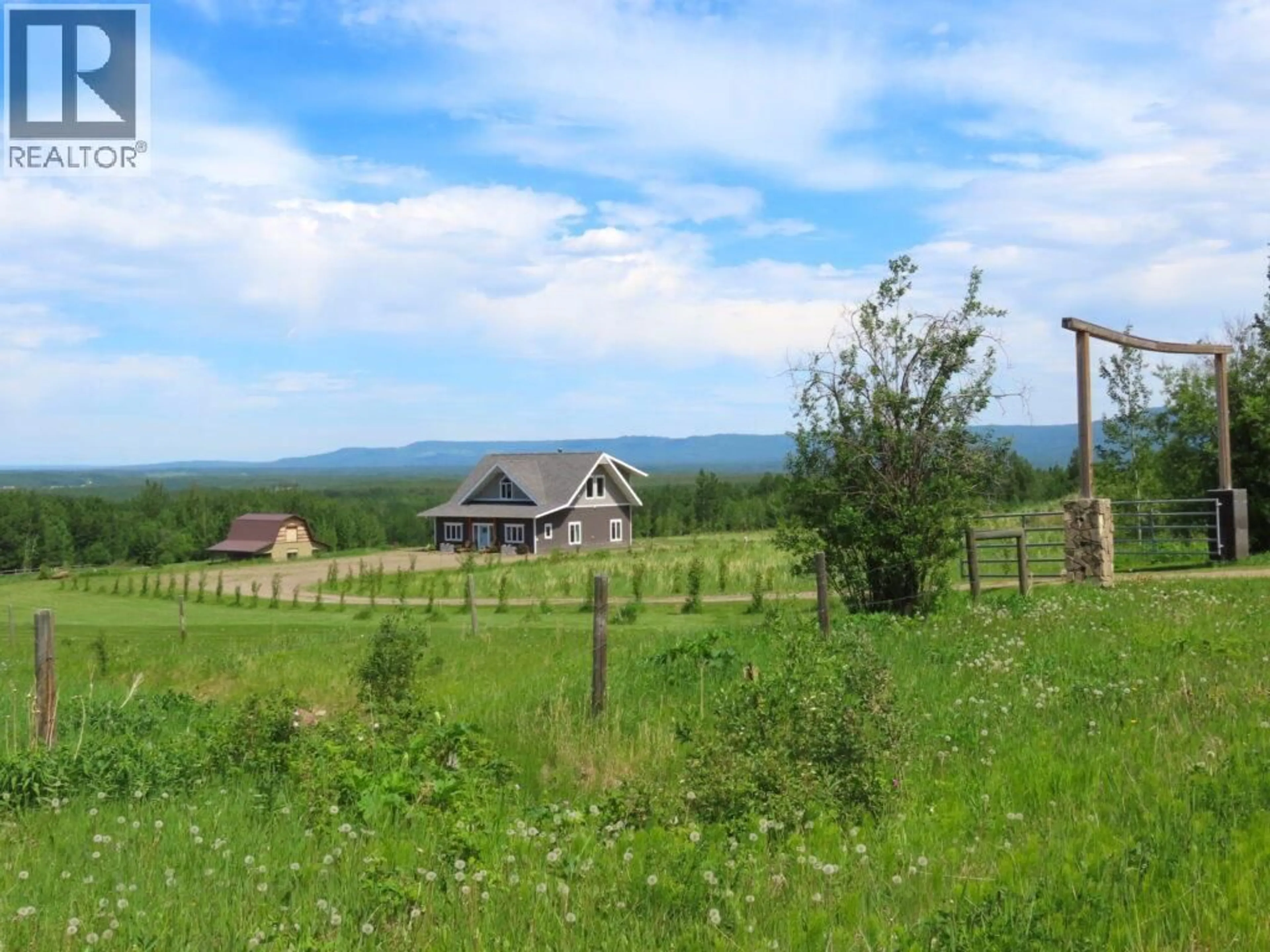 A pic from outside/outdoor area/front of a property/back of a property/a pic from drone, mountain view for 610 COWIE CREEK ROAD, Chetwynd British Columbia V0C1J0