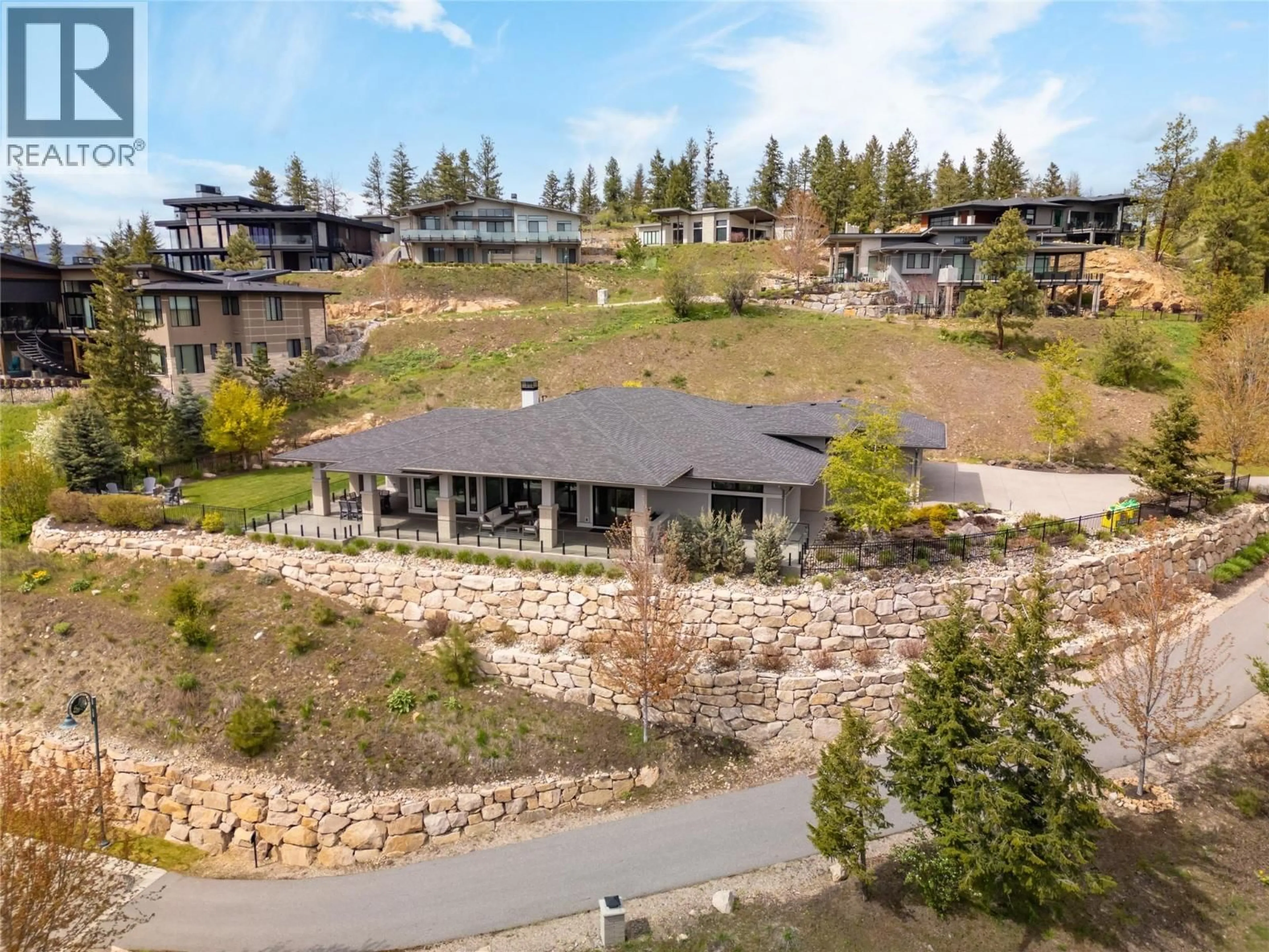 A pic from outside/outdoor area/front of a property/back of a property/a pic from drone, mountain view for 689 BIRDIE LAKE PLACE, Vernon British Columbia V1H2L3