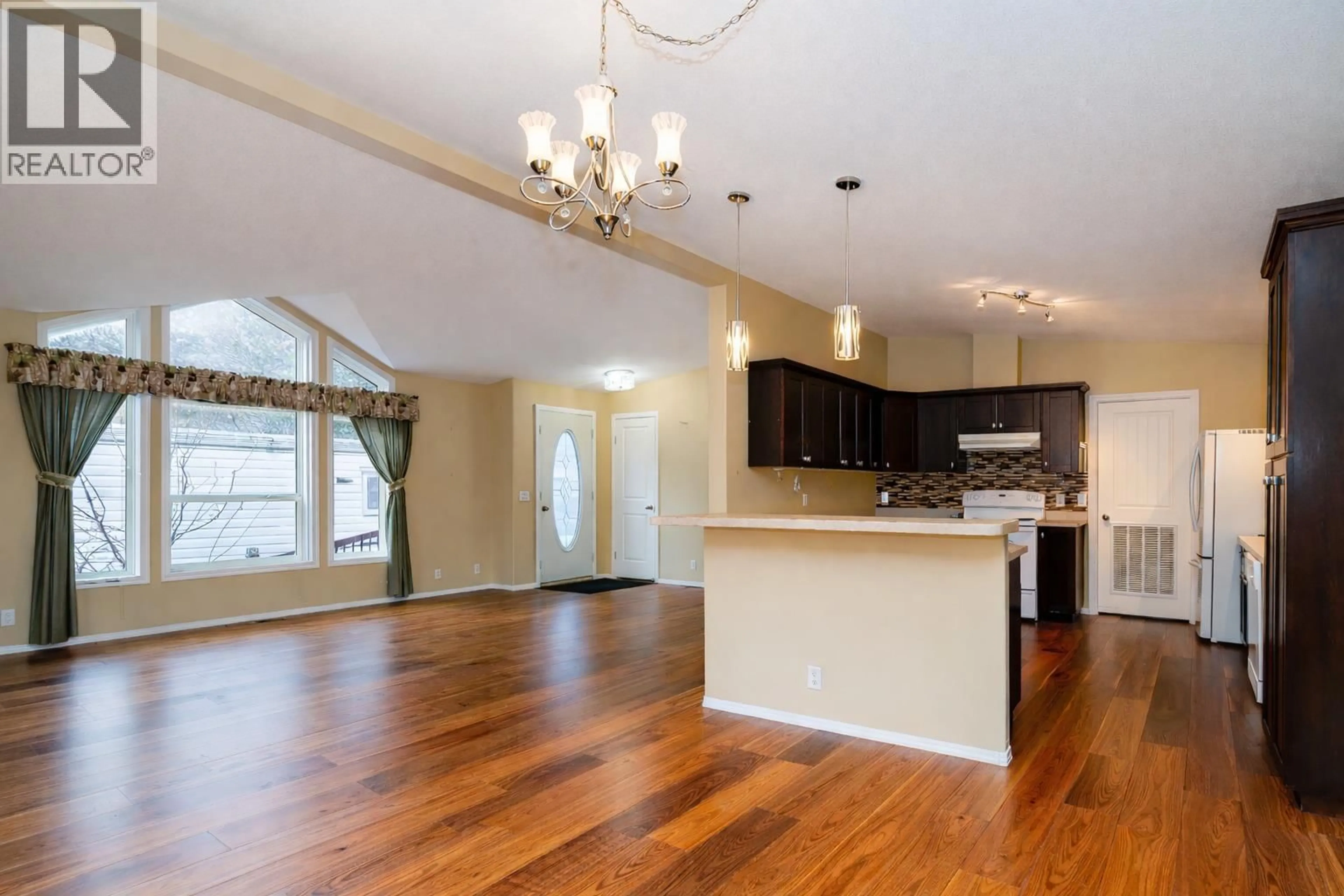 Open concept kitchen, wood/laminate floor for 7 - 1302 CEDAR STREET, Okanagan Falls British Columbia V0H1R4