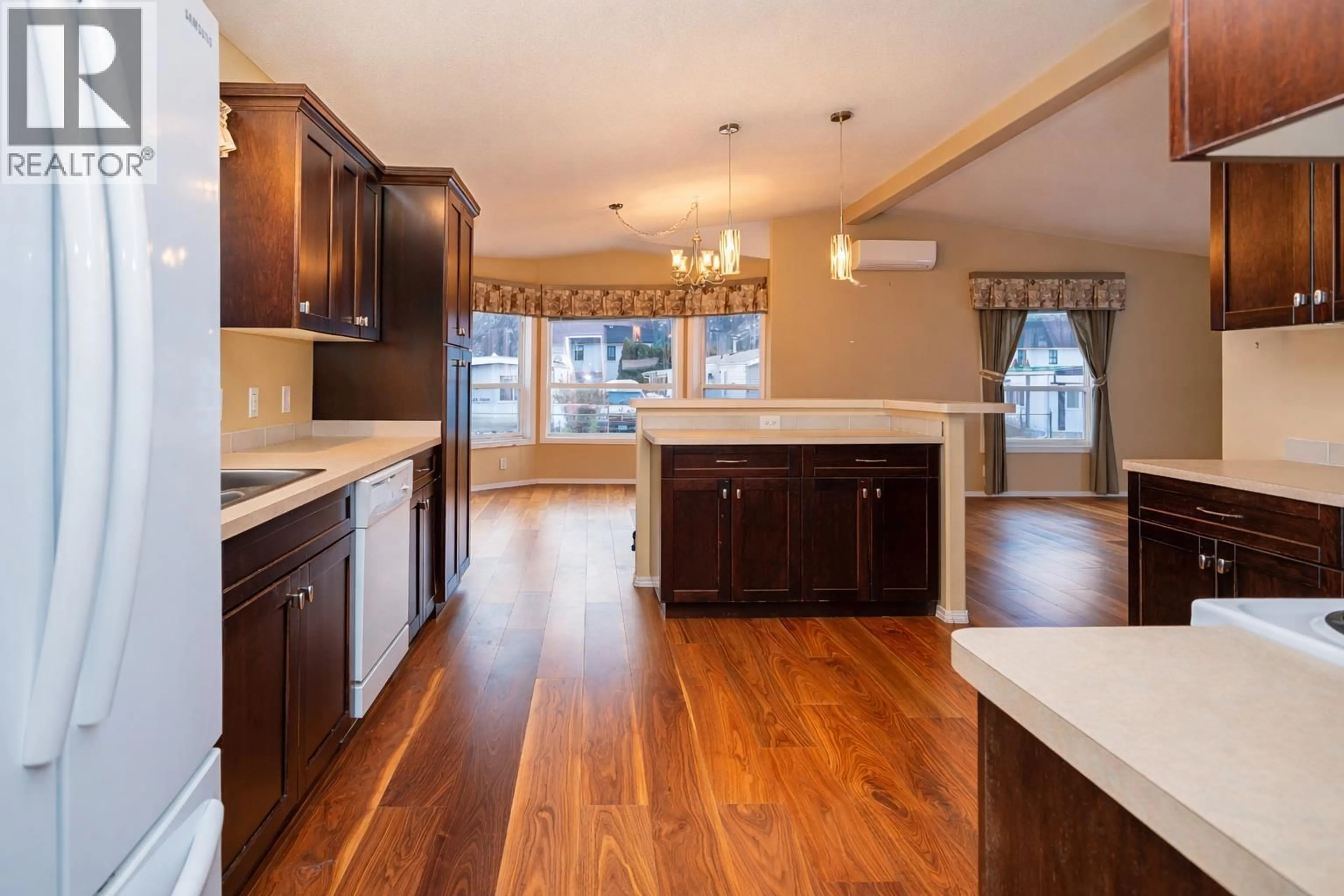 Open concept kitchen, wood/laminate floor for 7 - 1302 CEDAR STREET, Okanagan Falls British Columbia V0H1R4
