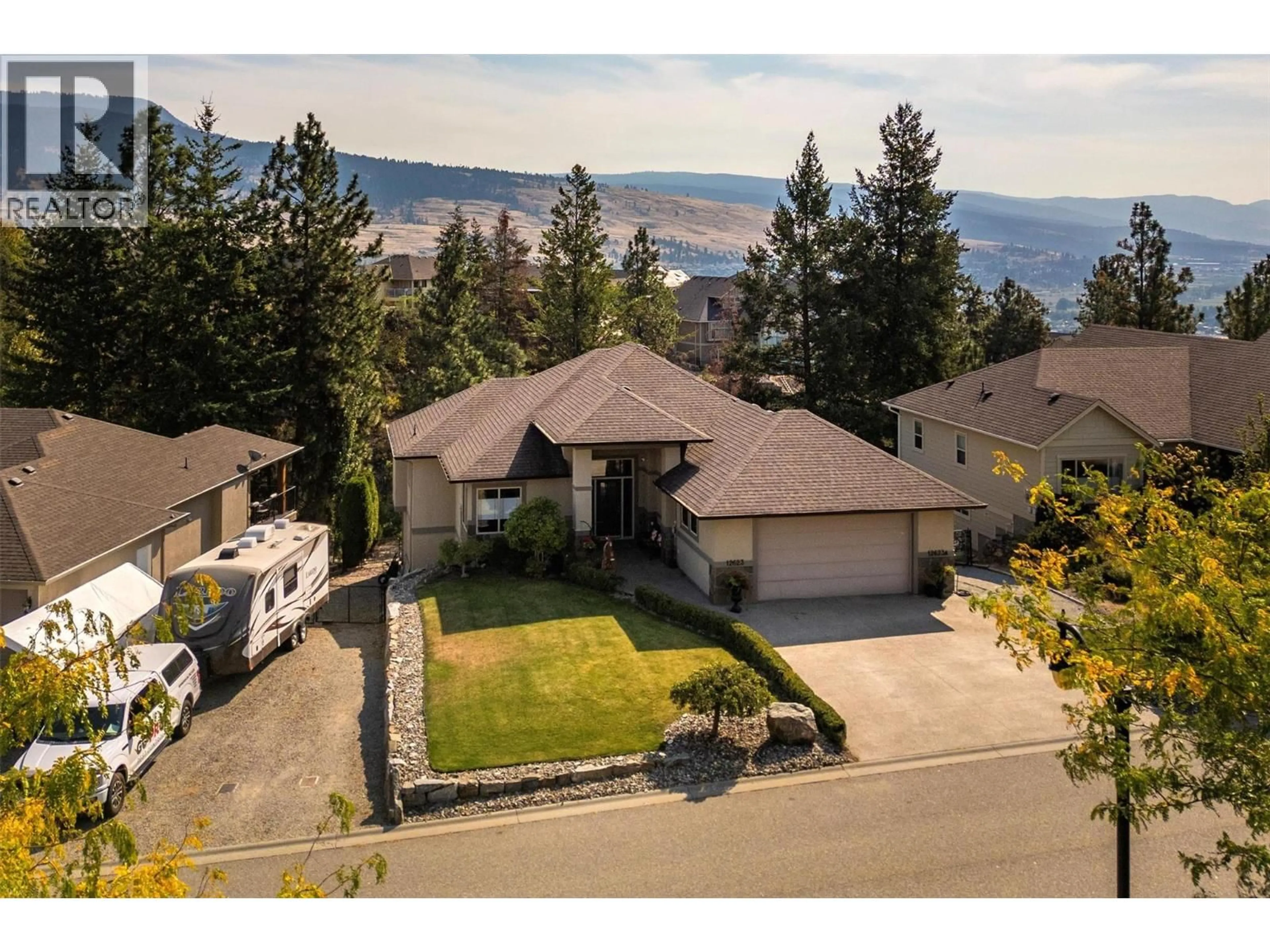 A pic from outside/outdoor area/front of a property/back of a property/a pic from drone, mountain view for 12623 DRIFTWOOD COURT, Lake Country British Columbia V4V2M9