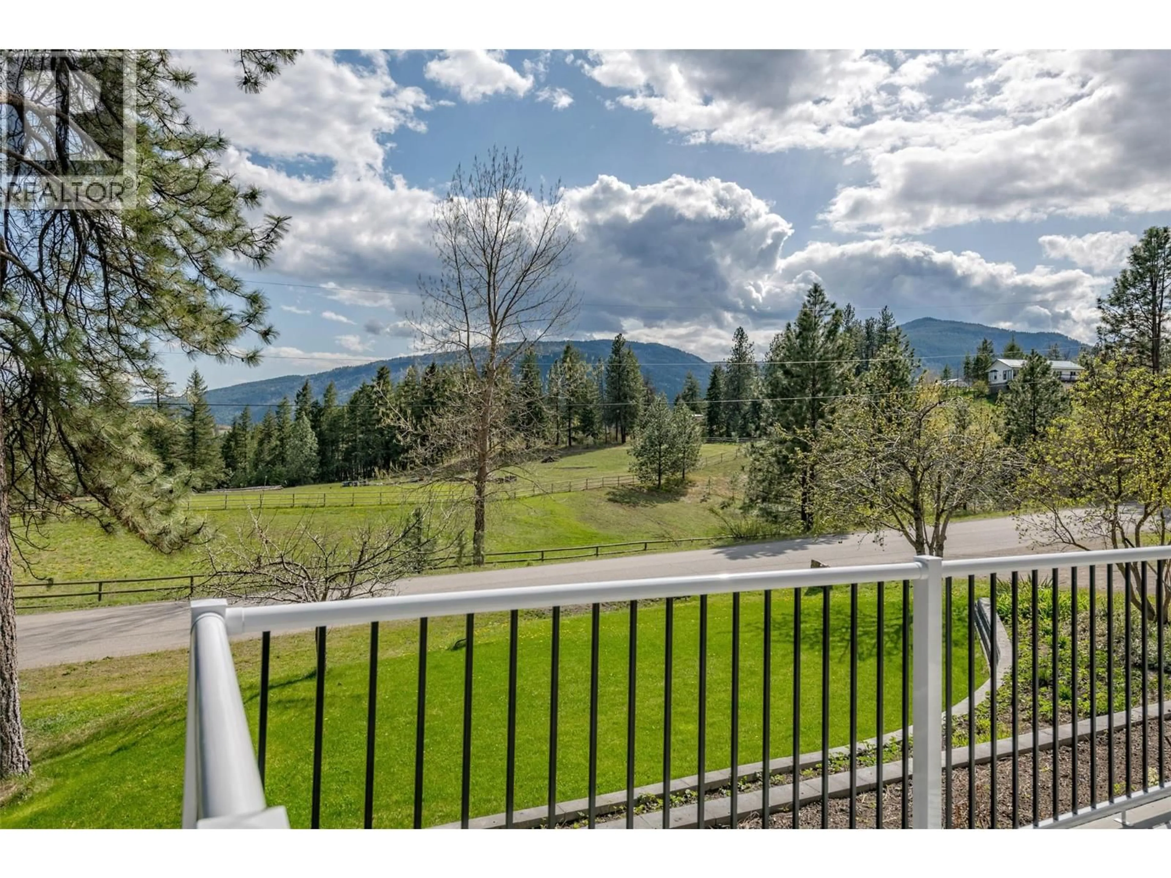 A pic from outside/outdoor area/front of a property/back of a property/a pic from drone, mountain view for 2962 MCTAVISH ROAD, Salmon Arm British Columbia V1E3J1