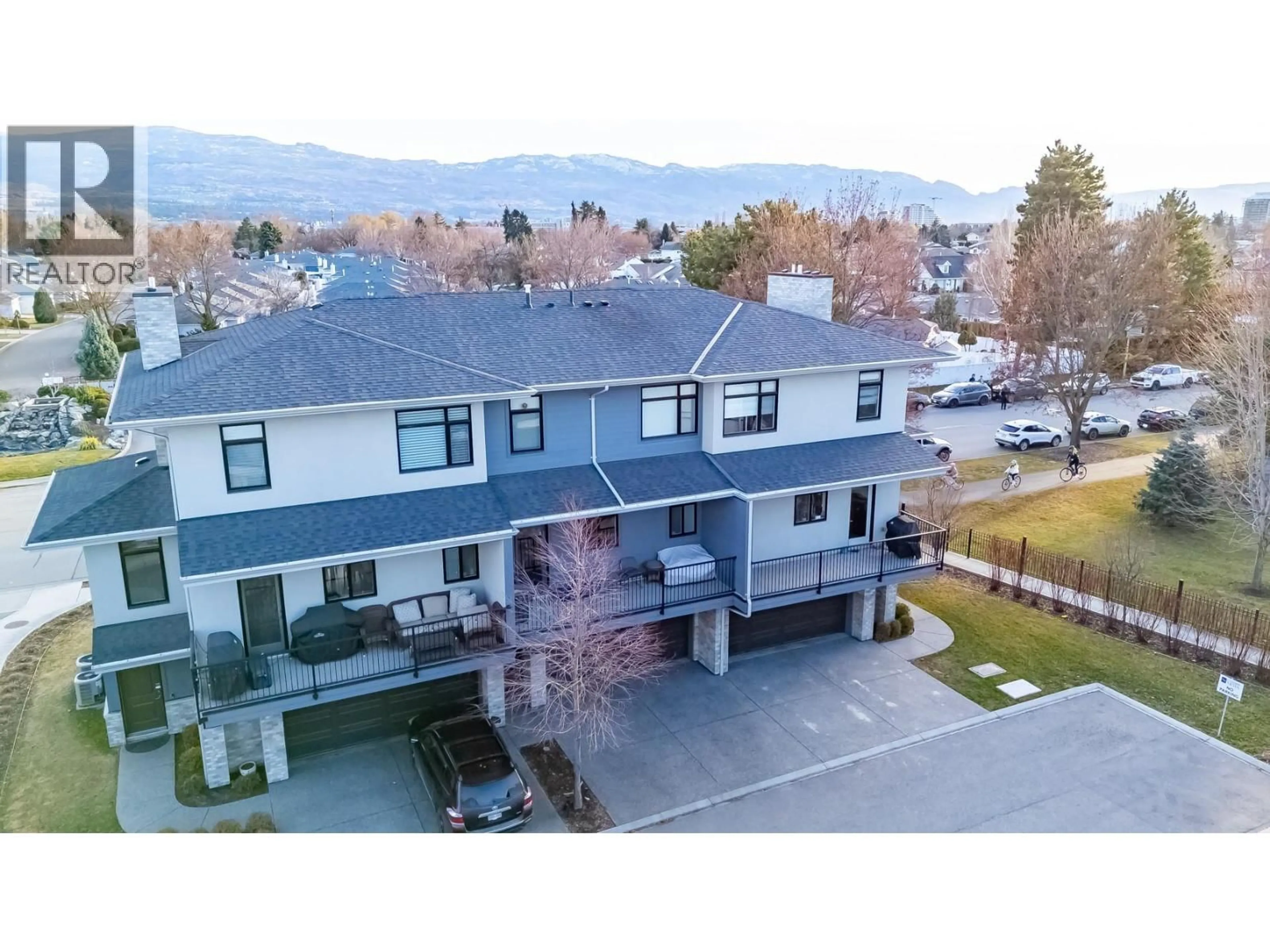 A pic from outside/outdoor area/front of a property/back of a property/a pic from drone, mountain view for 302 - 1102 CAMERON AVENUE, Kelowna British Columbia V1Y0B2