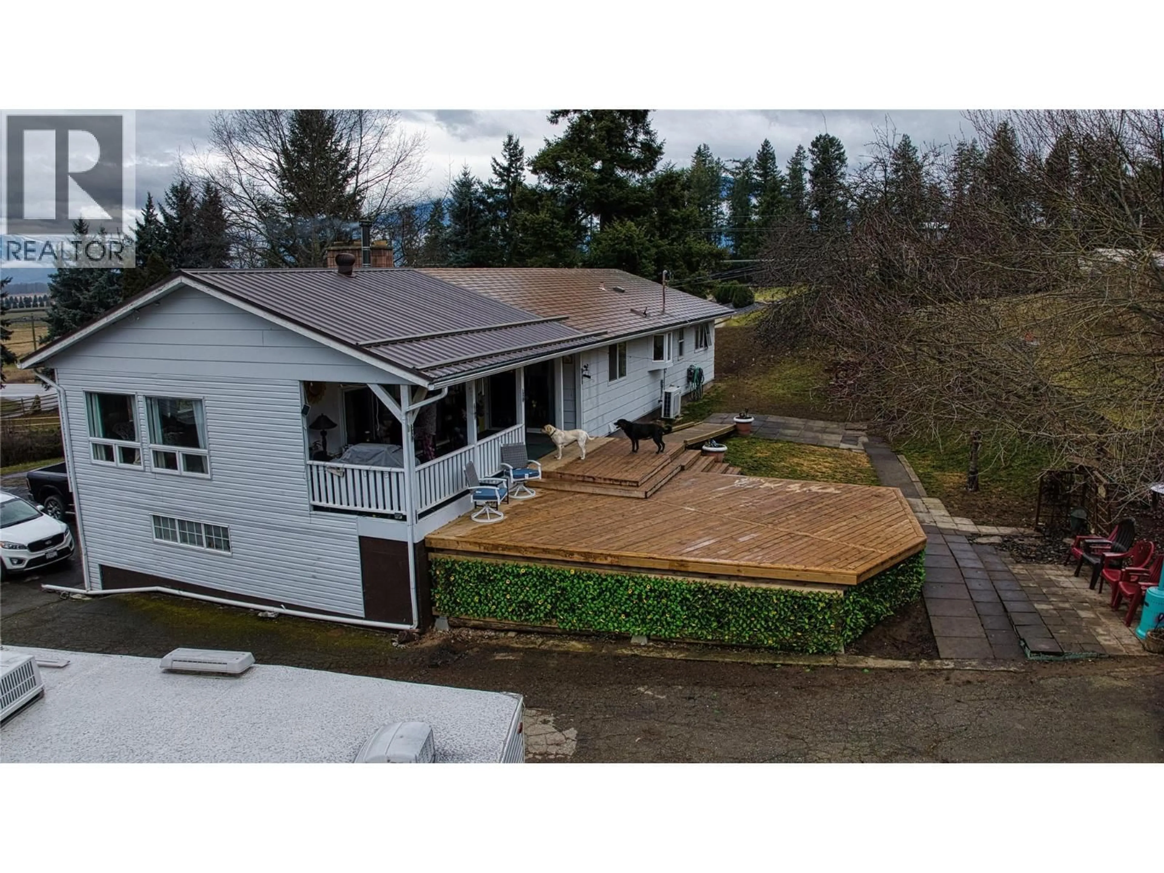 A pic from outside/outdoor area/front of a property/back of a property/a pic from drone, mountain view for 1530 21 HIGHWAY, Creston British Columbia V0B1G2