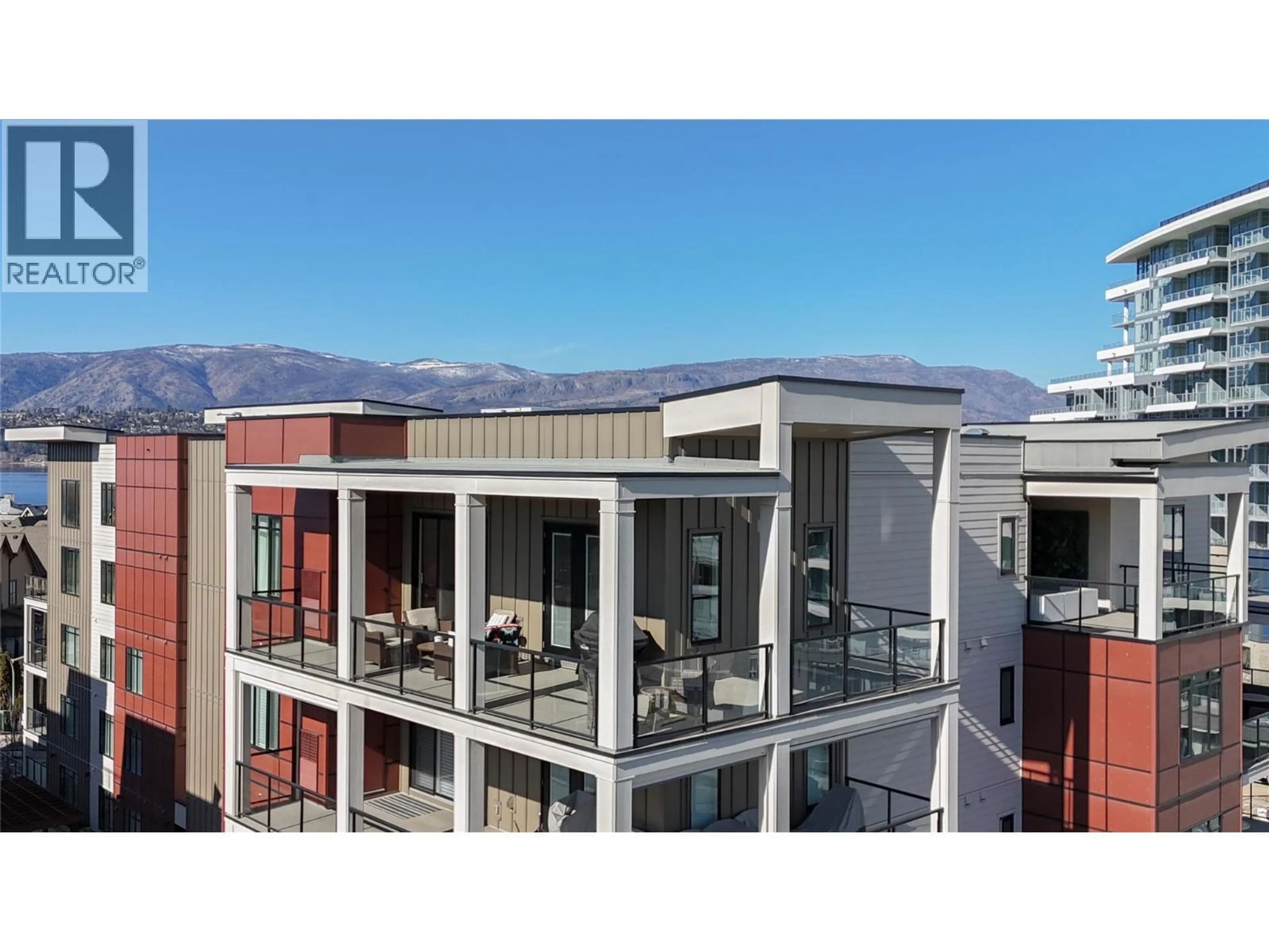 A pic from outside/outdoor area/front of a property/back of a property/a pic from drone, mountain view for 604 - 529 TRUSWELL ROAD, Kelowna British Columbia V1W3K7