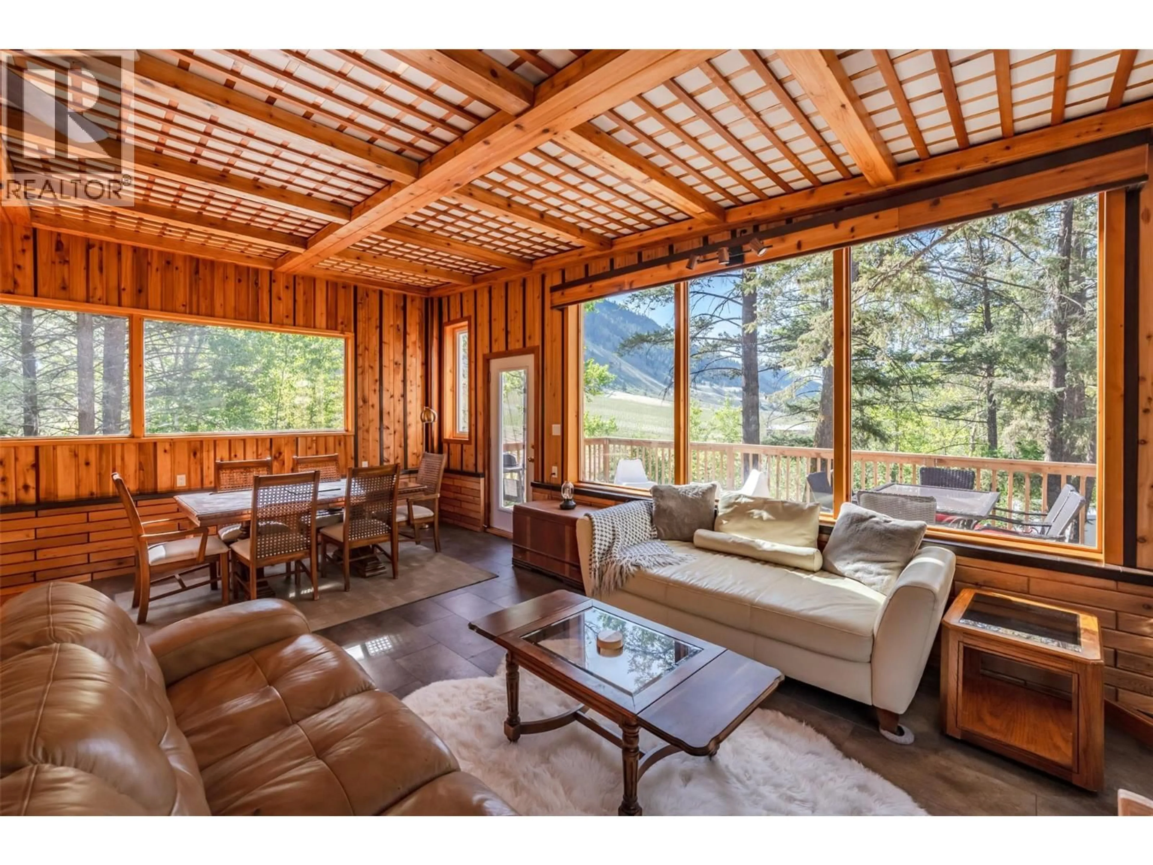 Living room with furniture, wood/laminate floor for 2636 11TH STREET, Olalla British Columbia V0X1N6