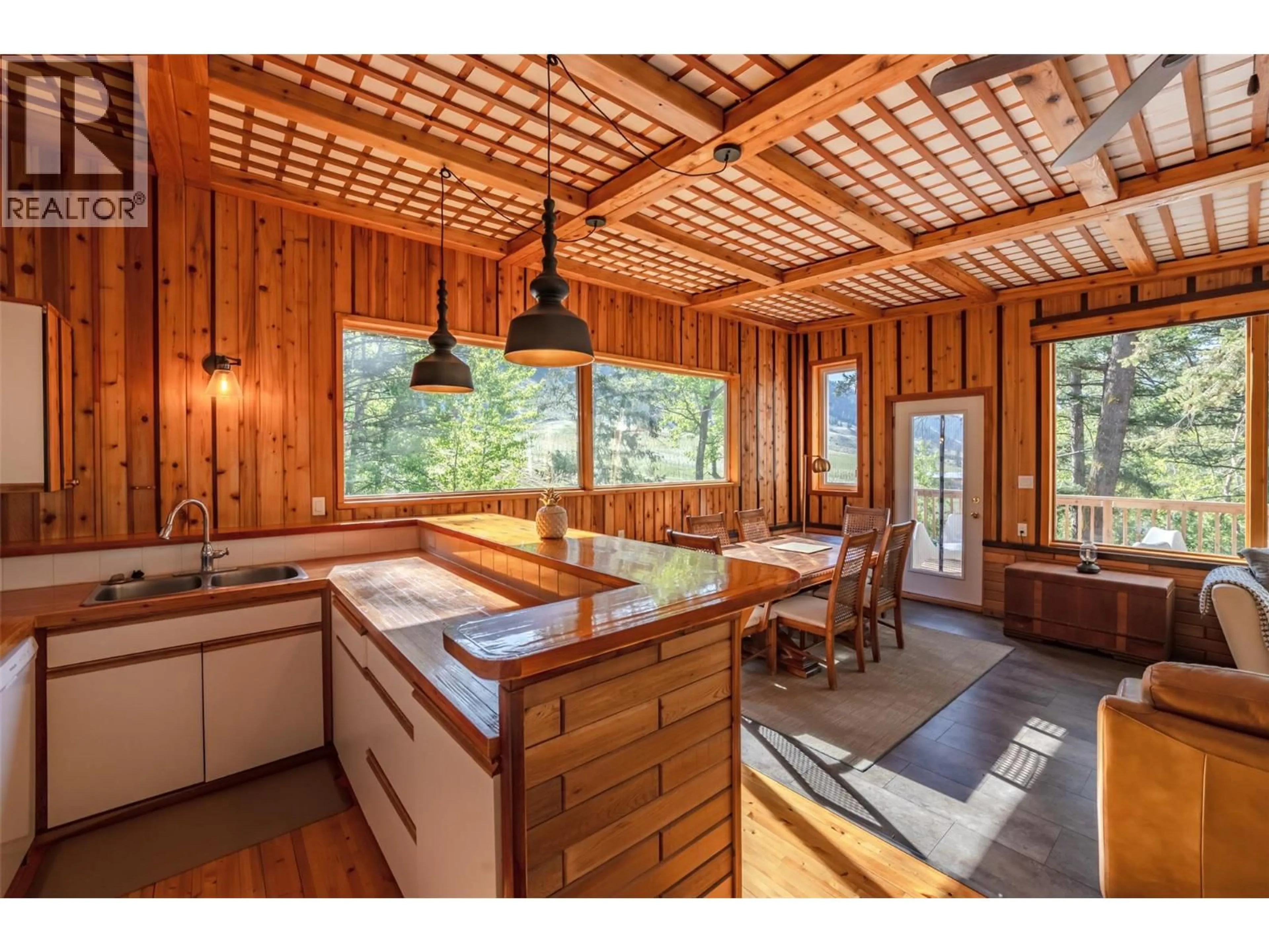 Open concept kitchen, wood/laminate floor for 2636 11TH STREET, Olalla British Columbia V0X1N6