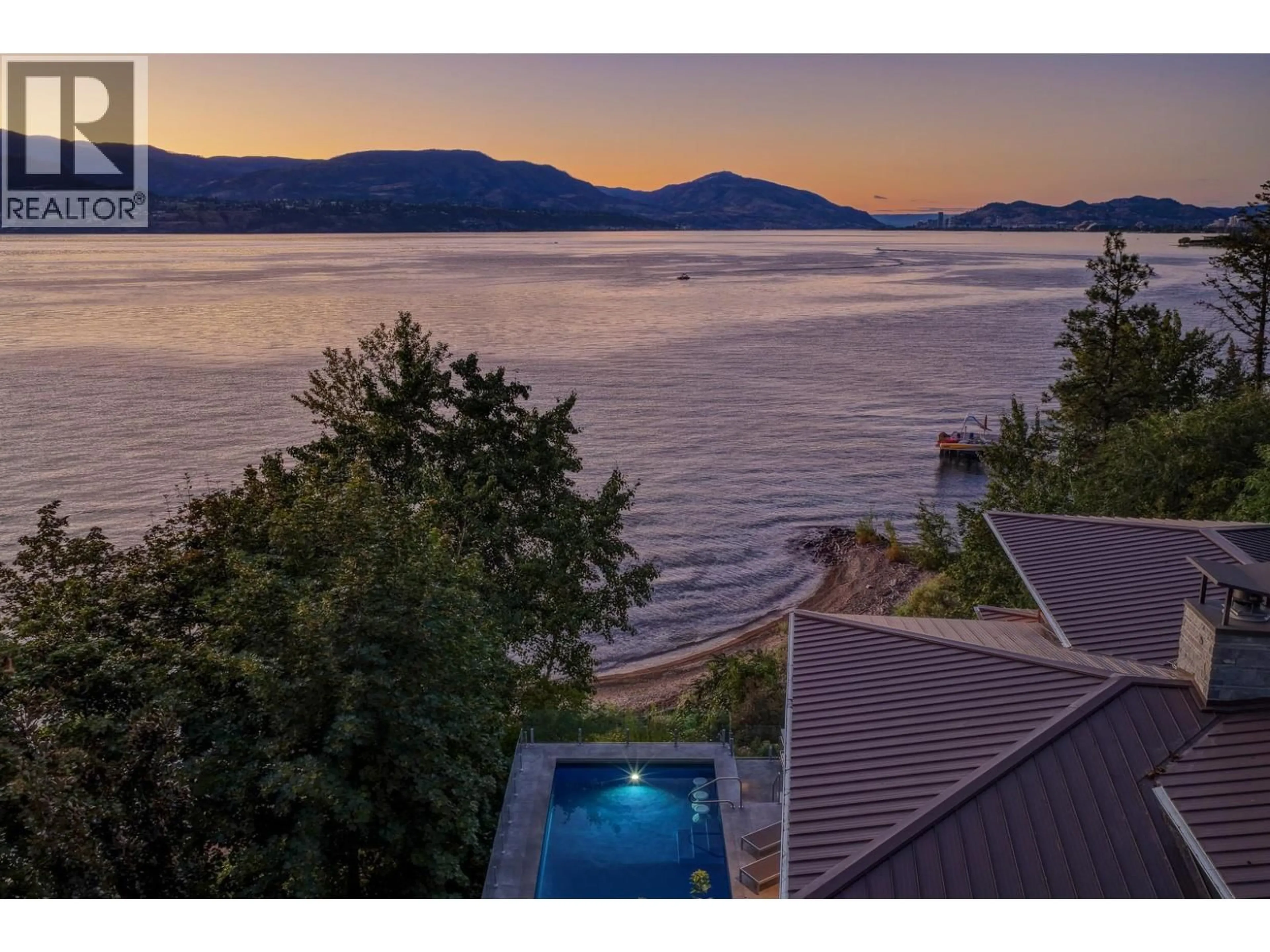 A pic from outside/outdoor area/front of a property/back of a property/a pic from drone, water/lake/river/ocean view for 4896 LAKESHORE ROAD, Kelowna British Columbia V1W4H7