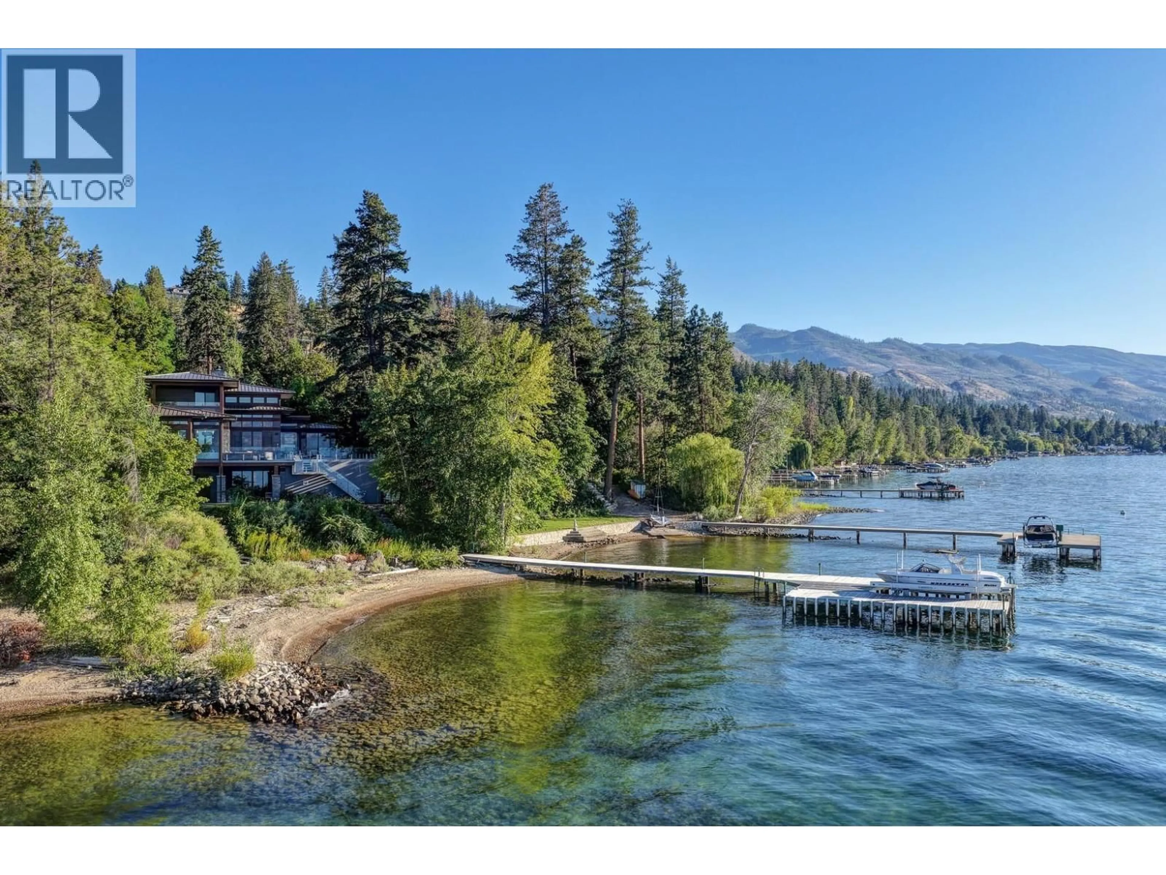 A pic from outside/outdoor area/front of a property/back of a property/a pic from drone, water/lake/river/ocean view for 4896 LAKESHORE ROAD, Kelowna British Columbia V1W4H7