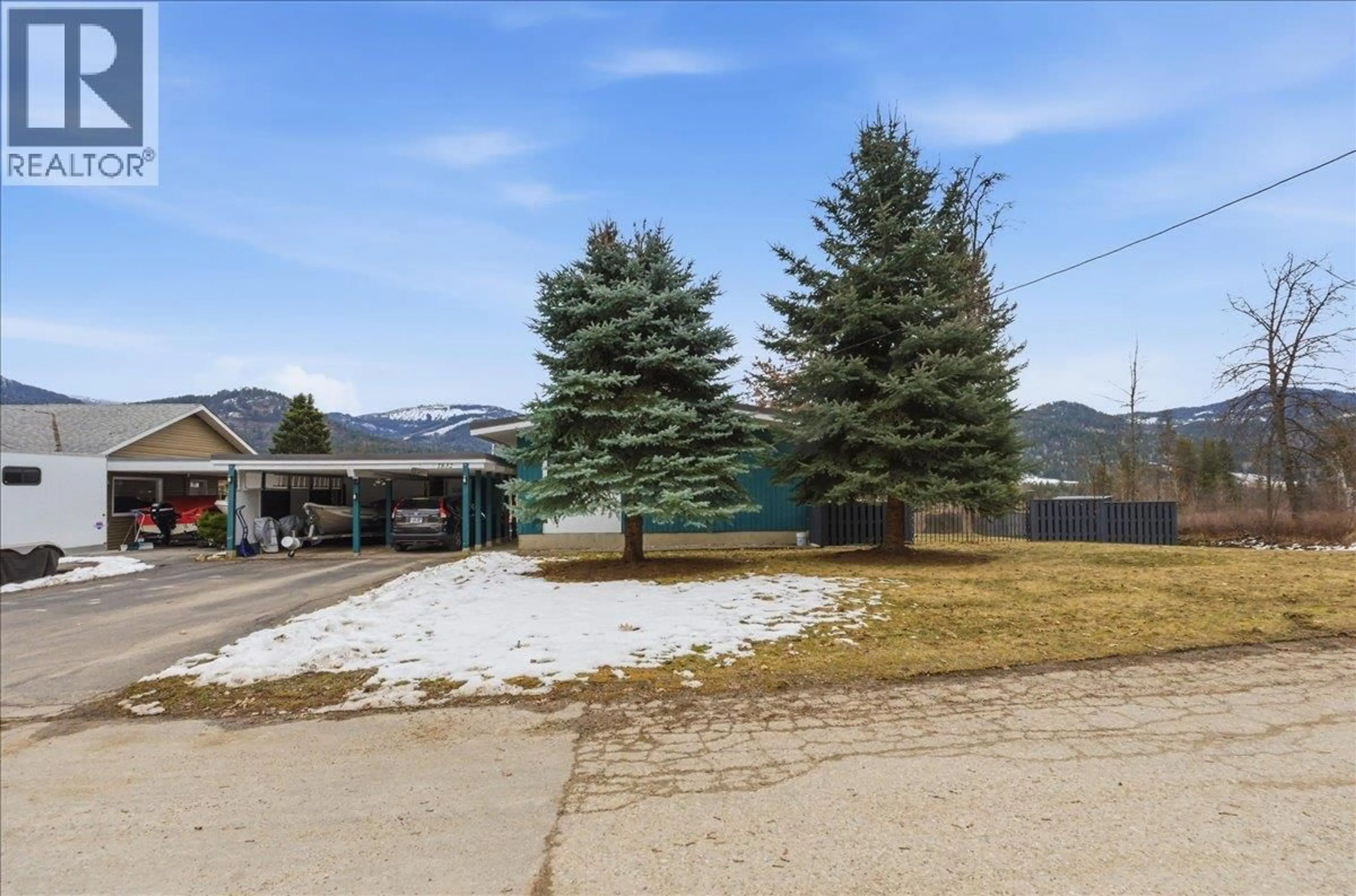 A pic from outside/outdoor area/front of a property/back of a property/a pic from drone, mountain view for 1832 THIRD STREET, Fruitvale British Columbia V0G1L1