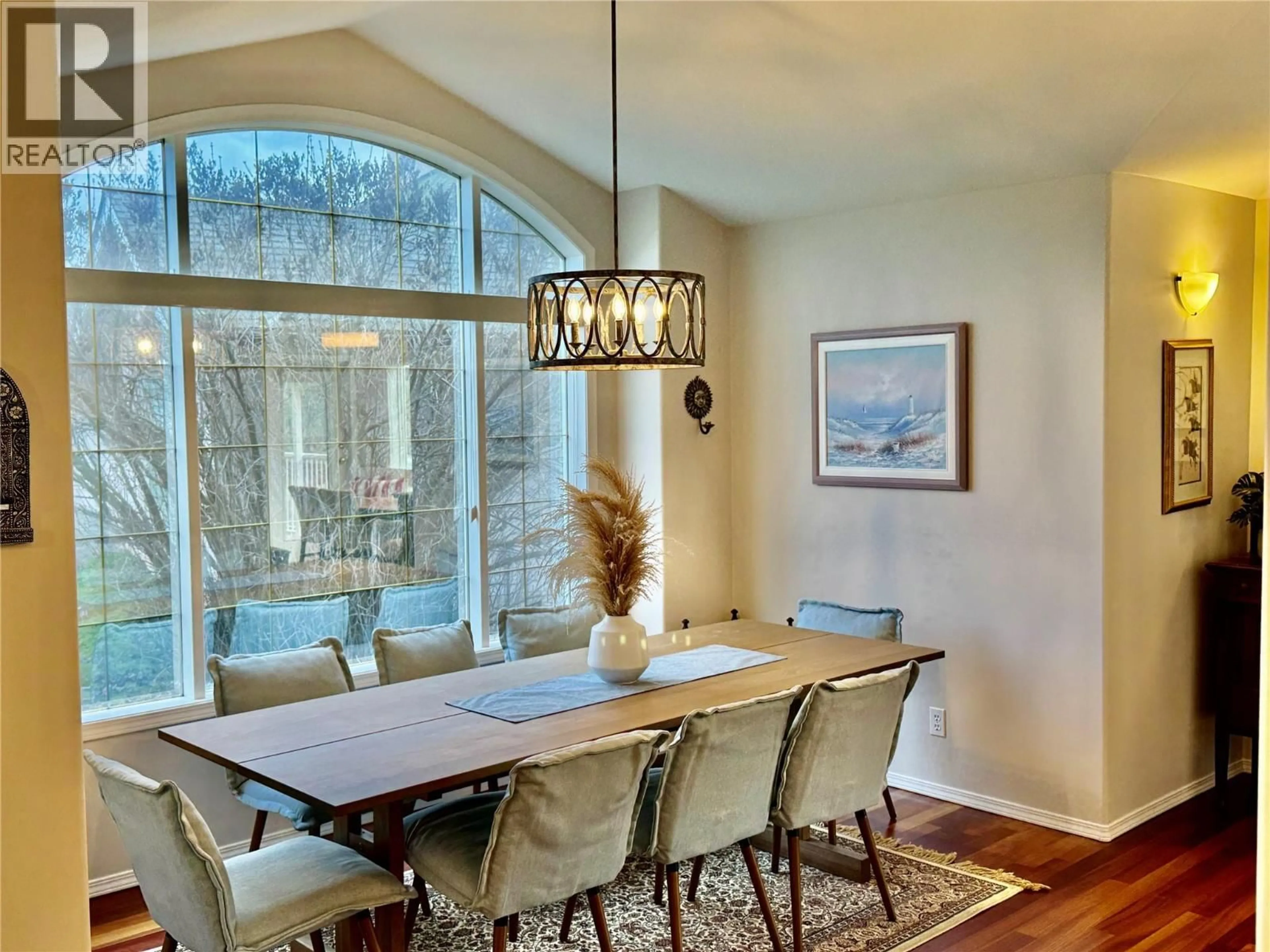 Dining room, wood/laminate floor for 773 SIWASH COURT, Kelowna British Columbia V1V1N5