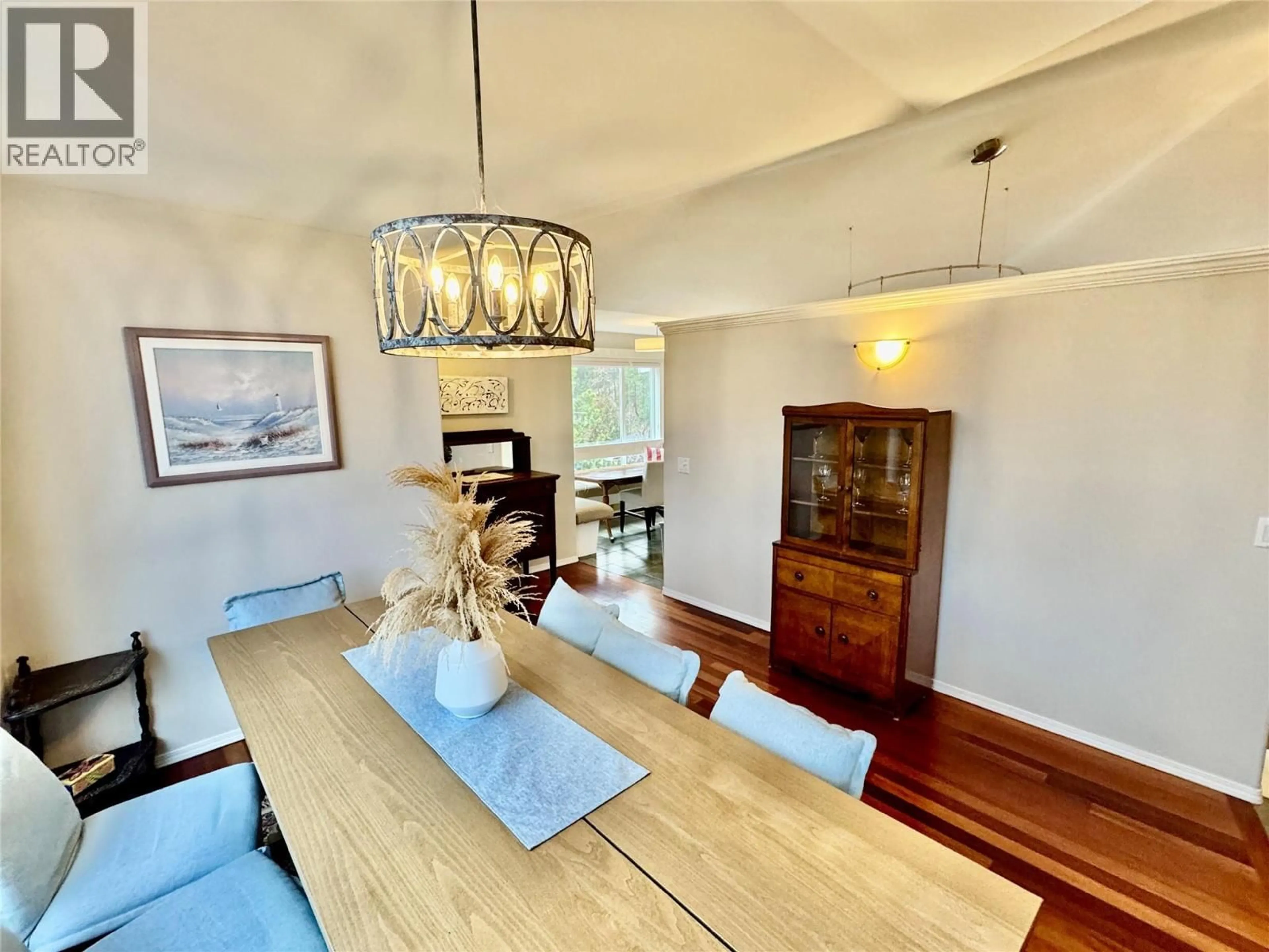 Dining room, wood/laminate floor for 773 SIWASH COURT, Kelowna British Columbia V1V1N5
