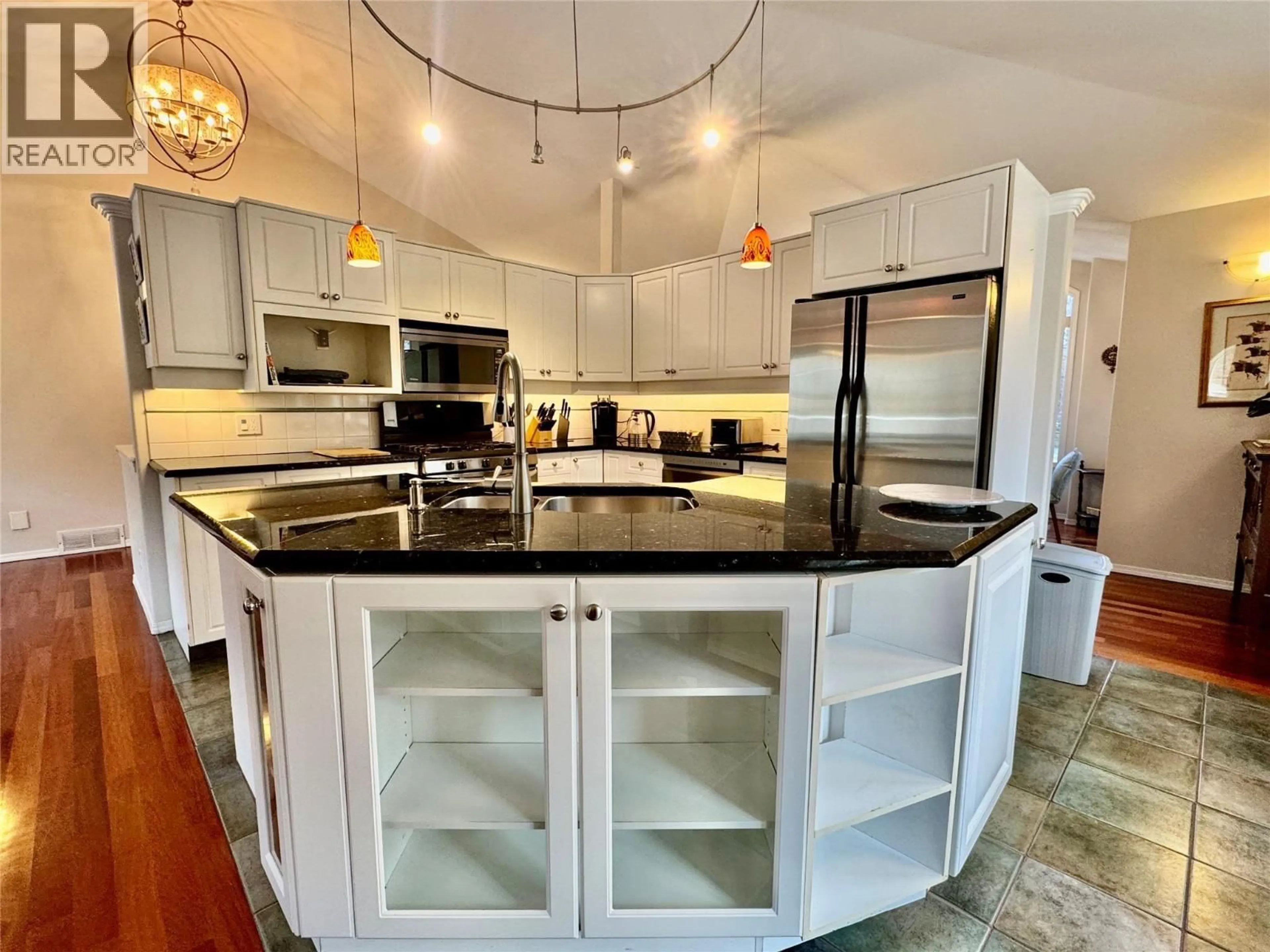 Open concept kitchen, ceramic/tile floor for 773 SIWASH COURT, Kelowna British Columbia V1V1N5