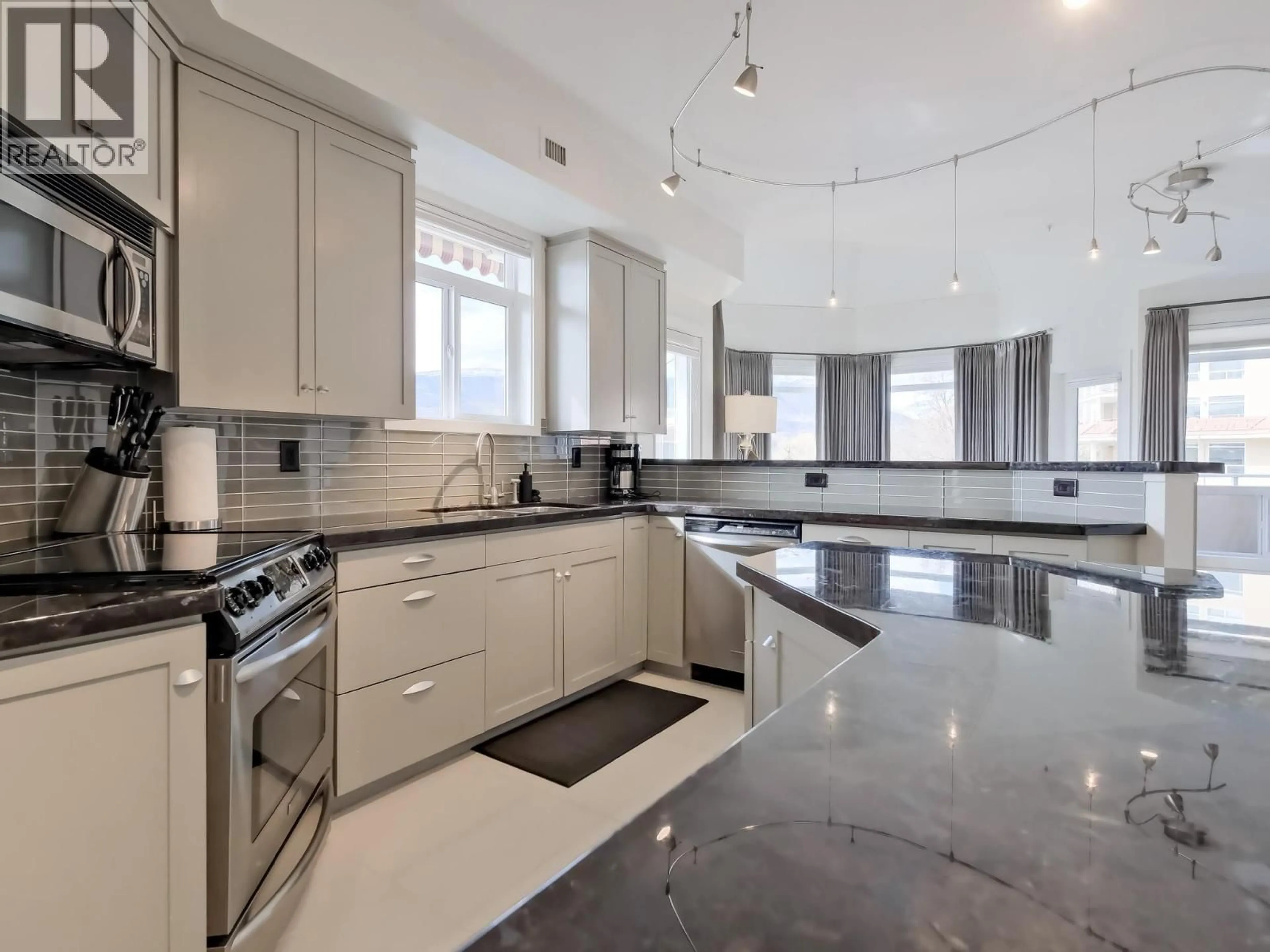 Contemporary kitchen, ceramic/tile floor for 221 - 1088 SUNSET DRIVE, Kelowna British Columbia V1Y9W1