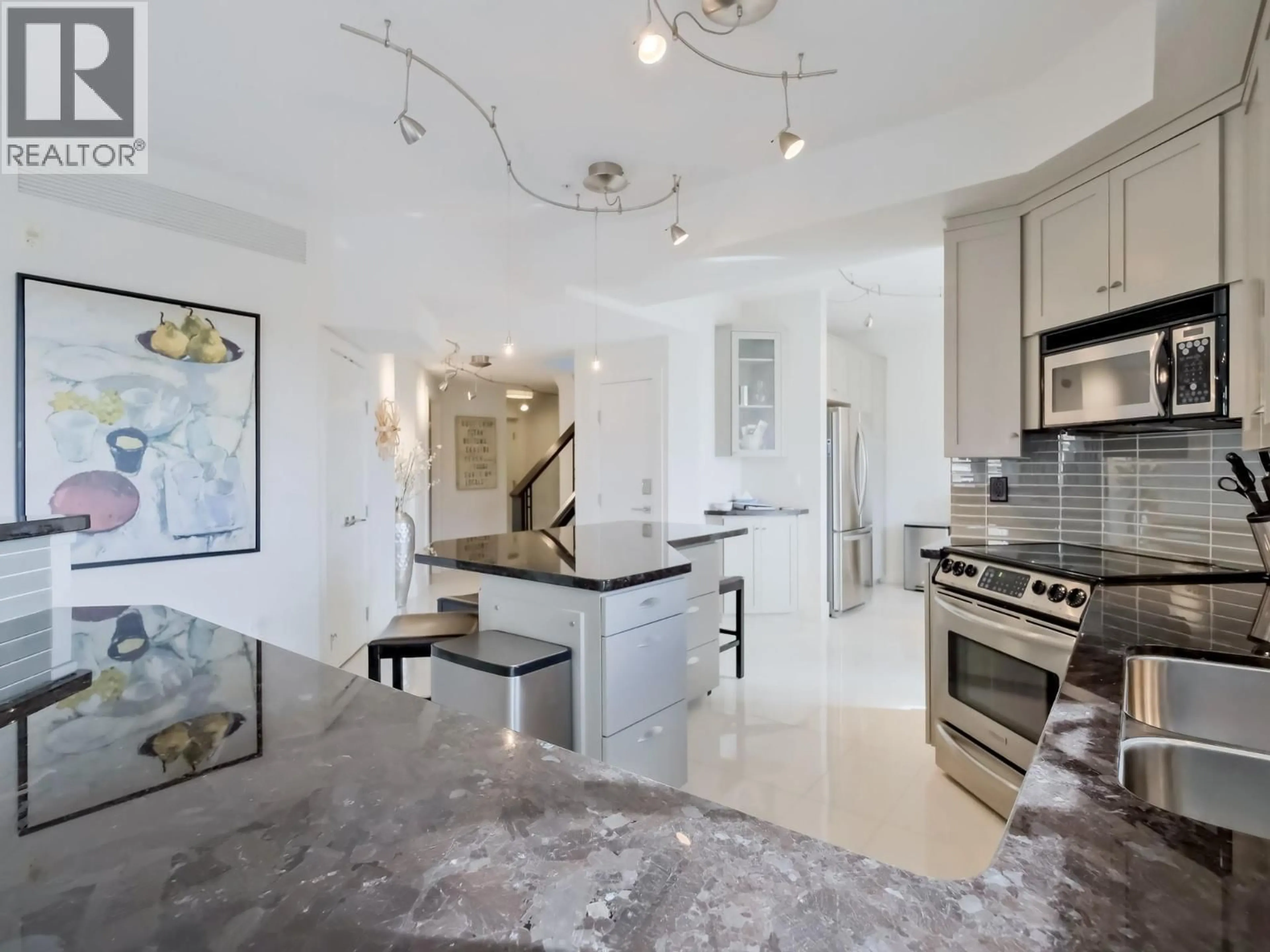 Contemporary kitchen, ceramic/tile floor for 221 - 1088 SUNSET DRIVE, Kelowna British Columbia V1Y9W1