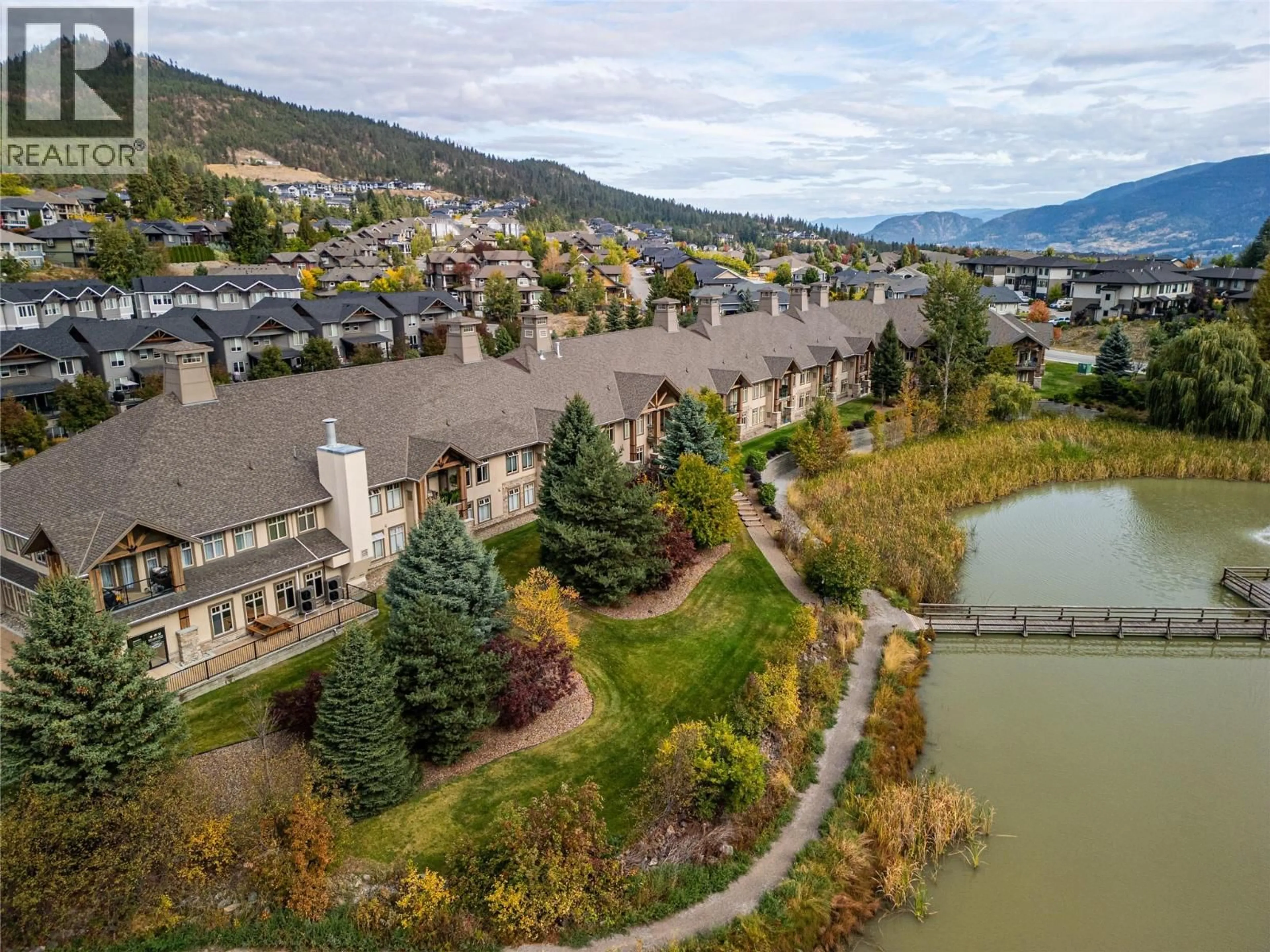 A pic from outside/outdoor area/front of a property/back of a property/a pic from drone, water/lake/river/ocean view for 114 - 2611 STILLWATER WAY, Lake Country British Columbia V4V2R3