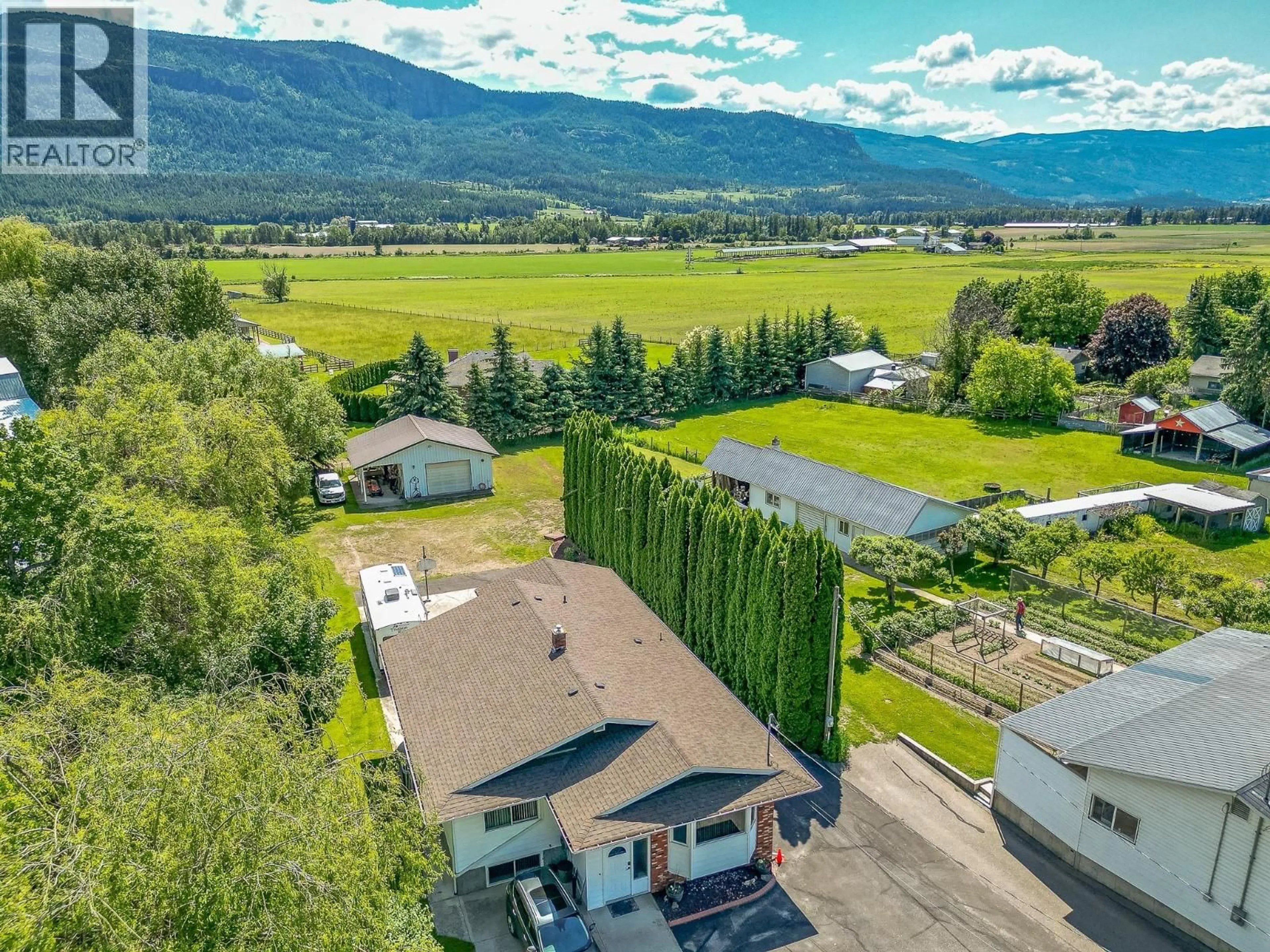 A pic from outside/outdoor area/front of a property/back of a property/a pic from drone, mountain view for 6601 97A HIGHWAY, Enderby British Columbia V0E1V3