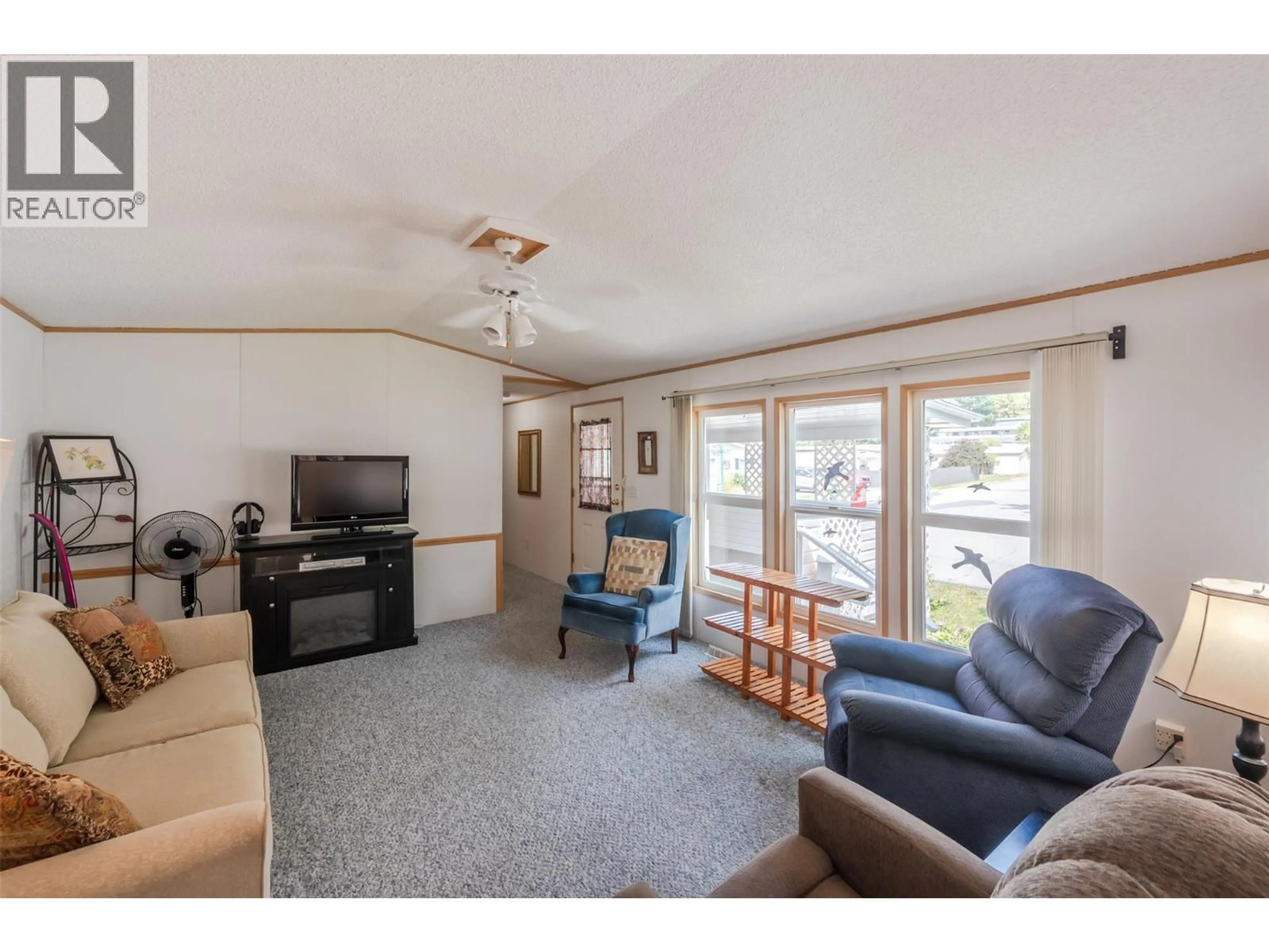 Living room with furniture, unknown for F22 - 4505 MCLEAN CREEK ROAD, Okanagan Falls British Columbia V0H1R1