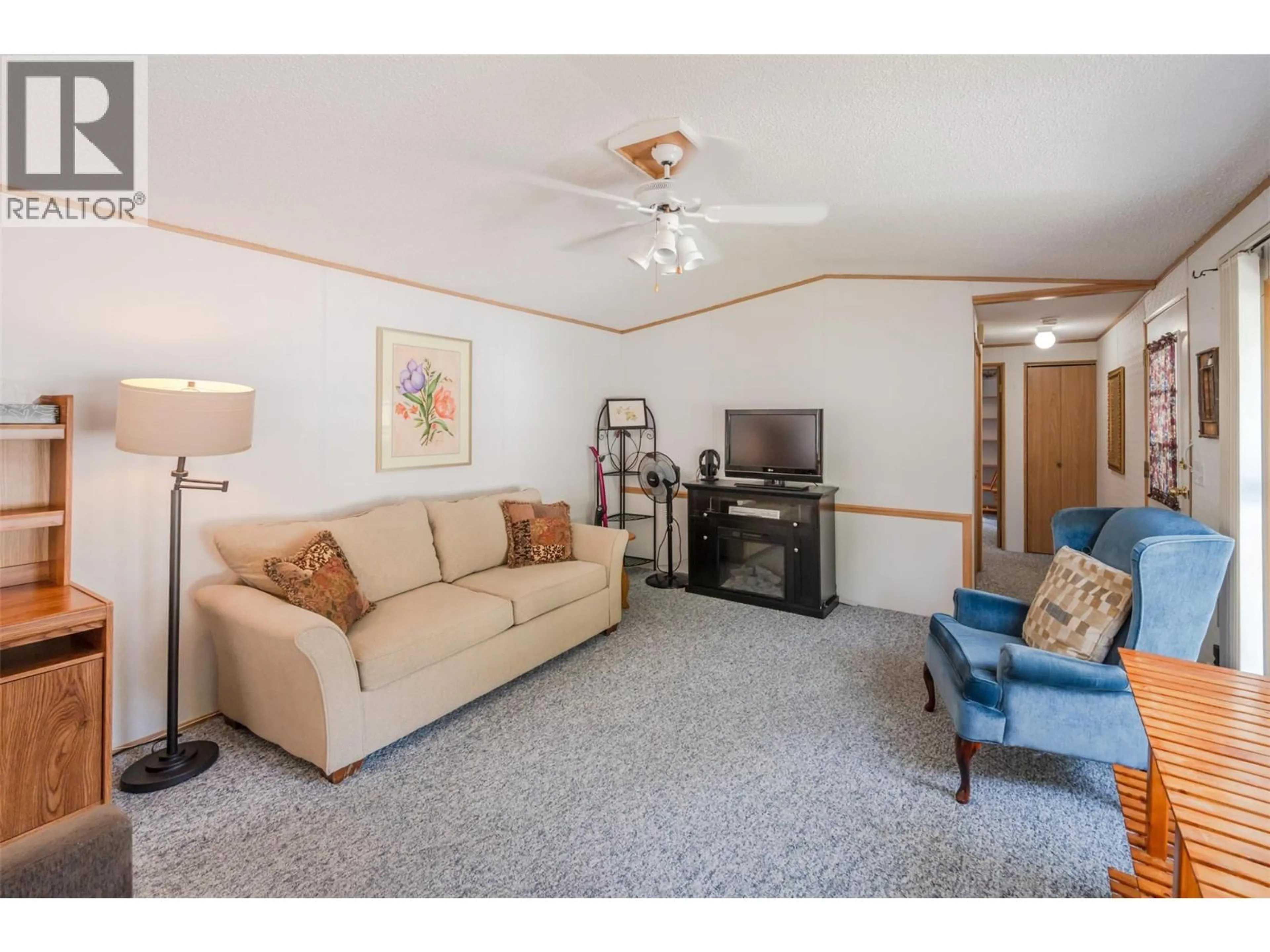 Living room with furniture, unknown for F22 - 4505 MCLEAN CREEK ROAD, Okanagan Falls British Columbia V0H1R1