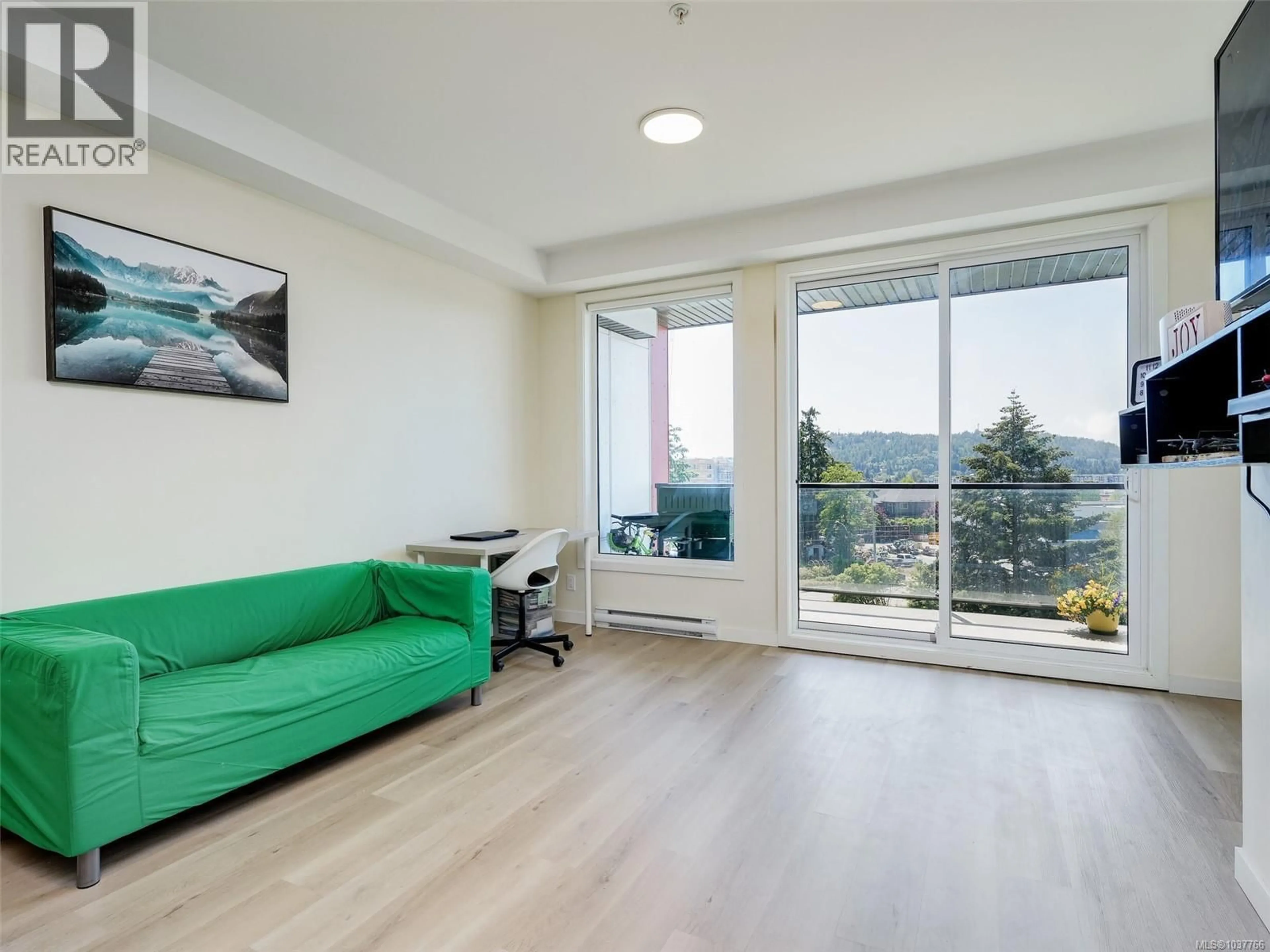 Living room with furniture, wood/laminate floor for 504 - 815 ORONO AVENUE, Langford British Columbia V9B2T9