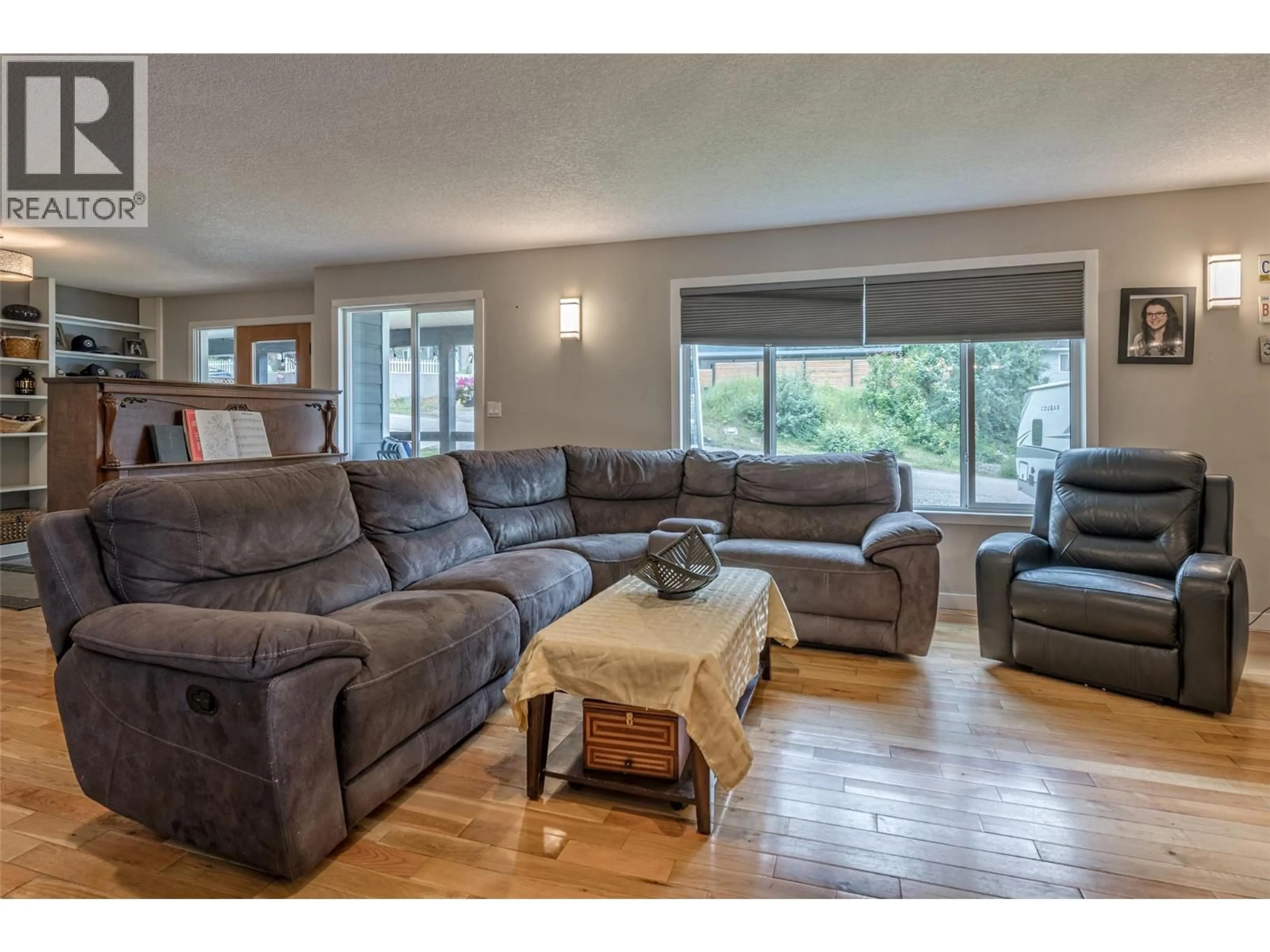 Living room with furniture, wood/laminate floor for 3286 UPPER MCLEOD ROAD, Spallumcheen British Columbia V4Y0S6