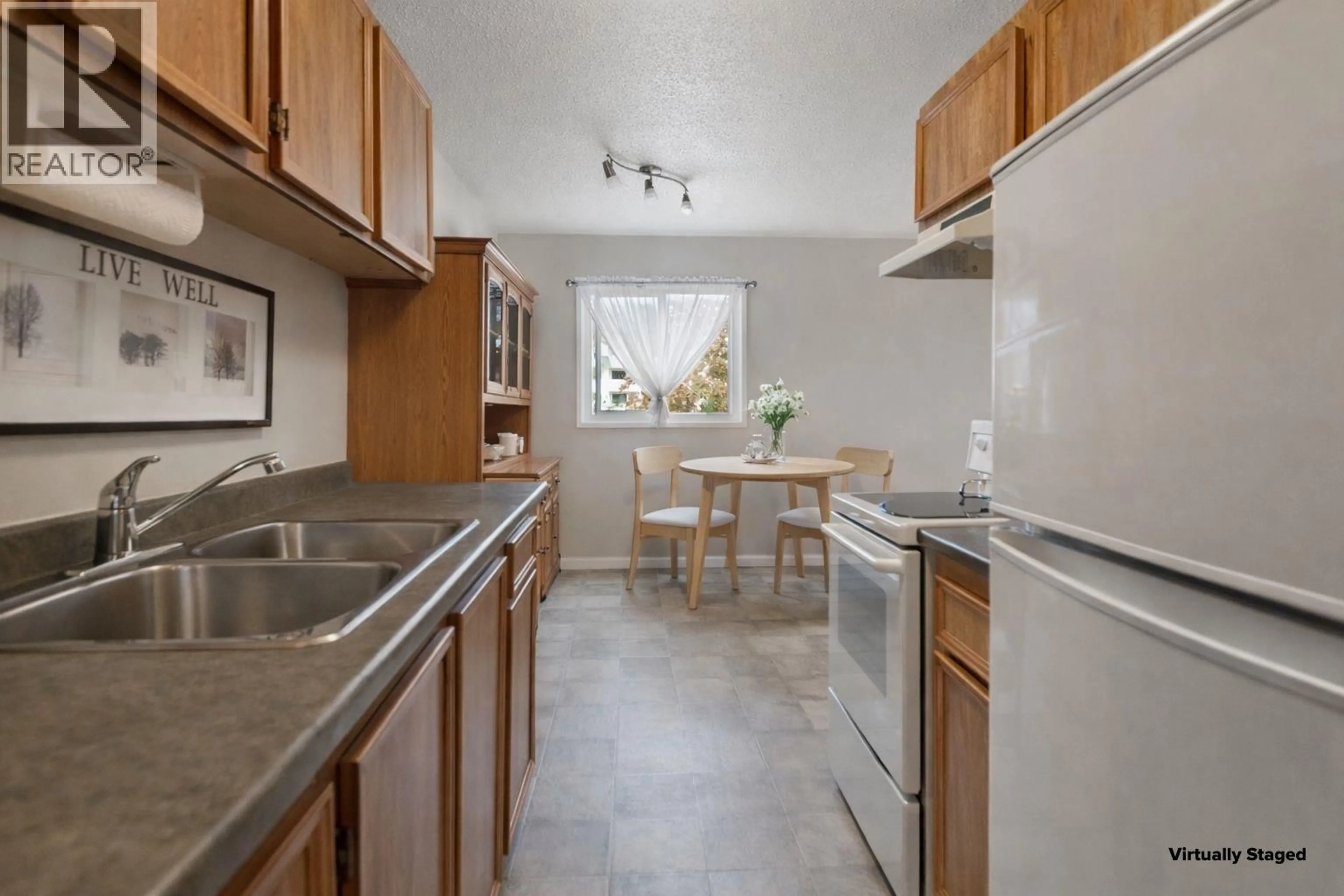Standard kitchen, ceramic/tile floor for 205 - 130 SKAHA PLACE, Penticton British Columbia V2A7J6