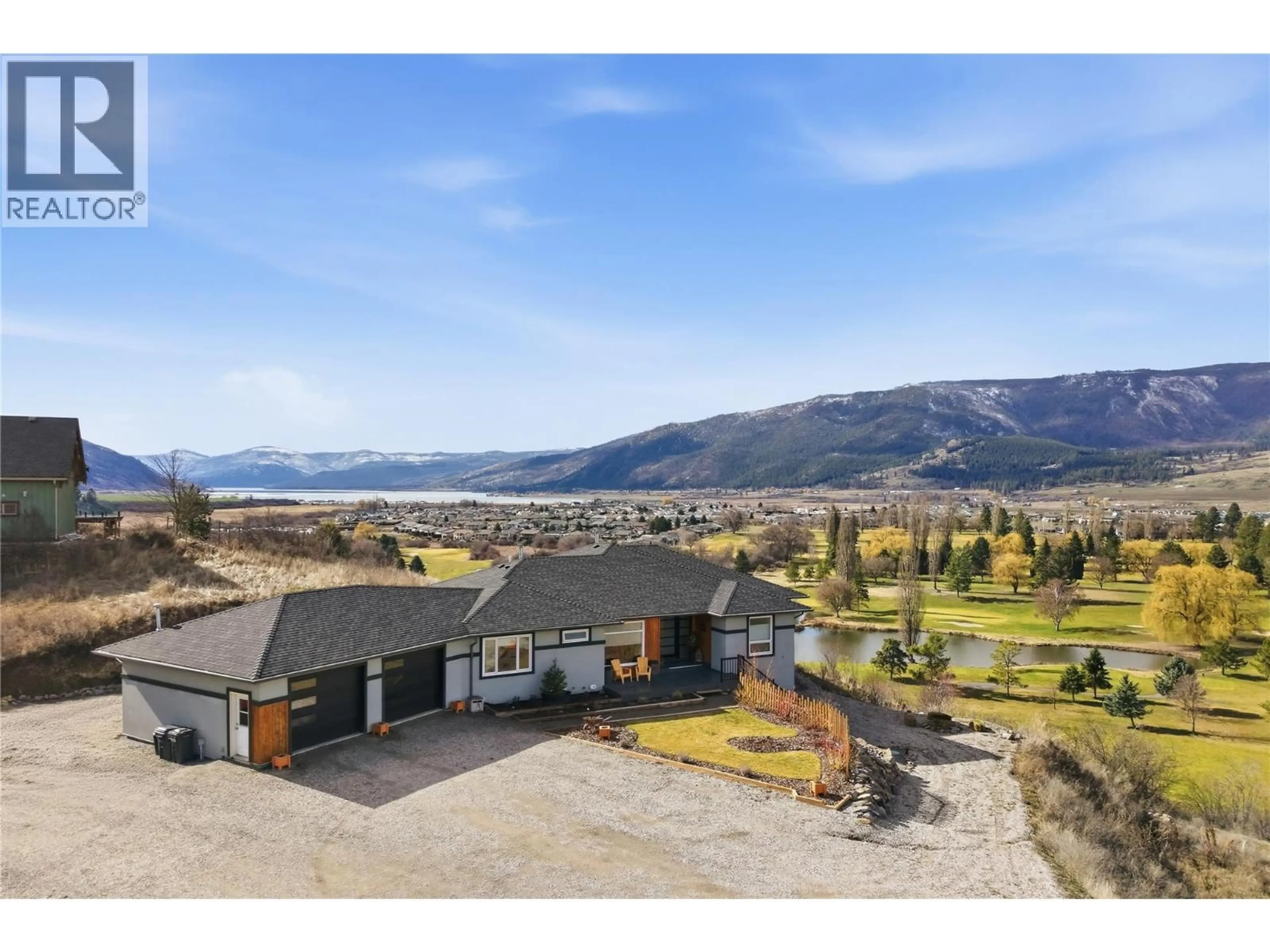 A pic from outside/outdoor area/front of a property/back of a property/a pic from drone, mountain view for 463 GOLFVIEW PLACE, Spallumcheen British Columbia V1H2J9