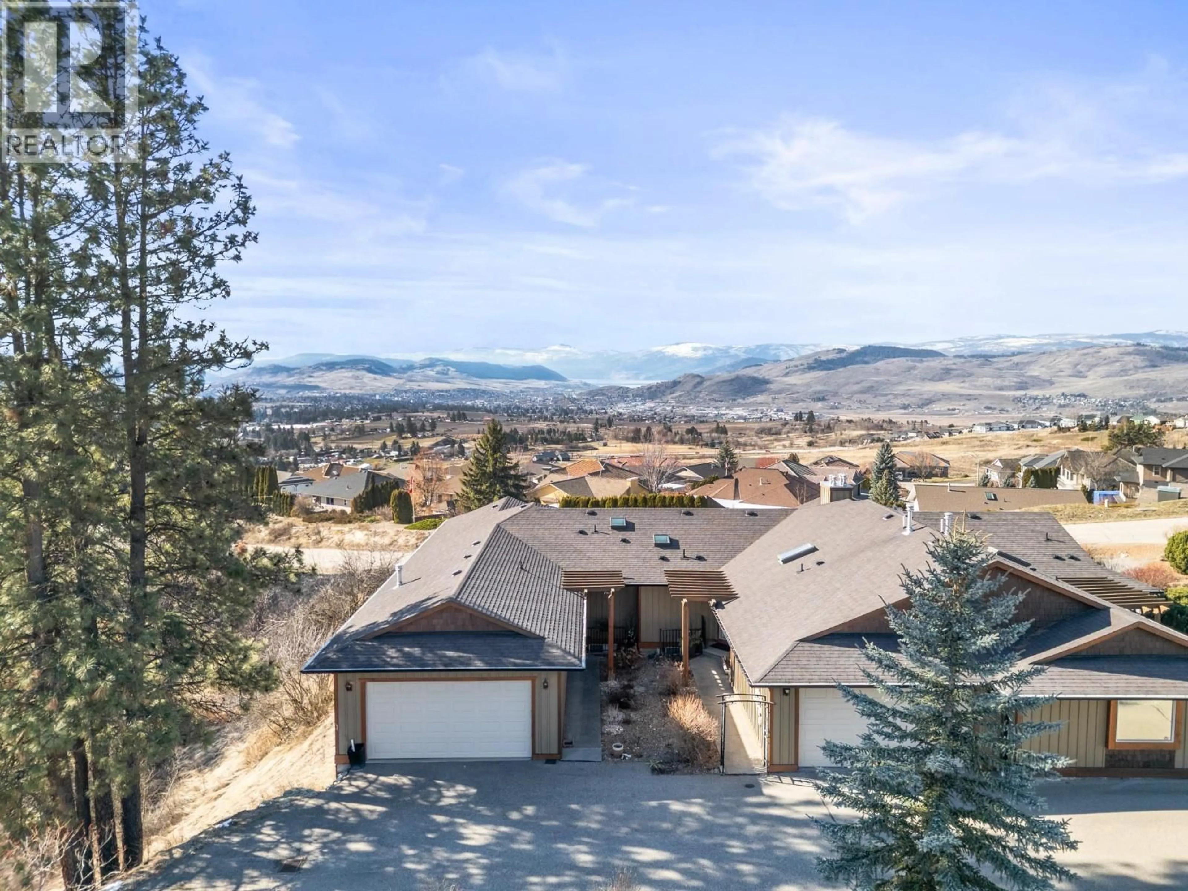 A pic from outside/outdoor area/front of a property/back of a property/a pic from drone, mountain view for 3 - 6900 MANNING PLACE, Vernon British Columbia V1B2Y5