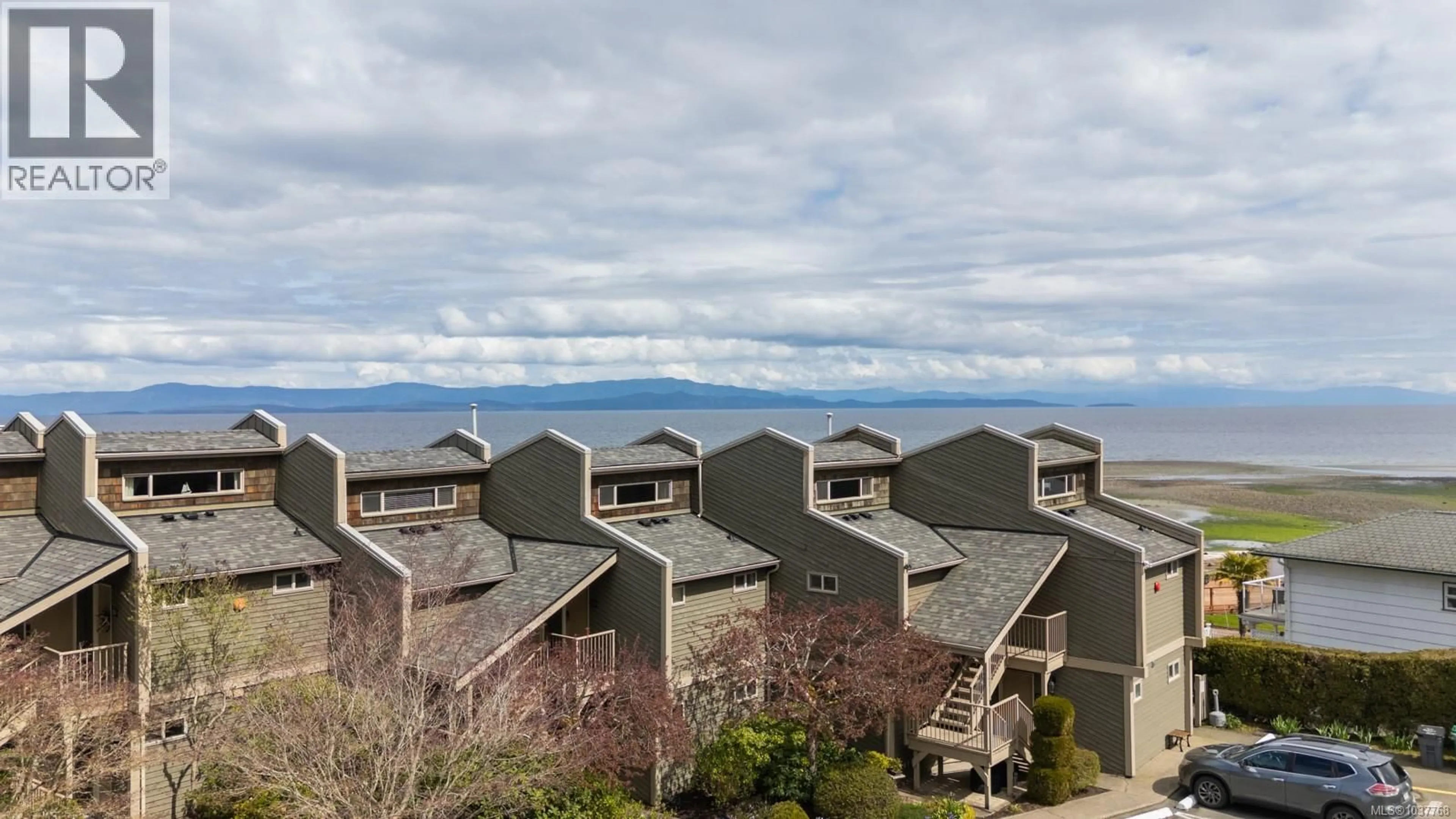 A pic from outside/outdoor area/front of a property/back of a property/a pic from drone, mountain view for 220 - 3295 ISLAND HIGHWAY WEST, Qualicum Beach British Columbia V9K2C6
