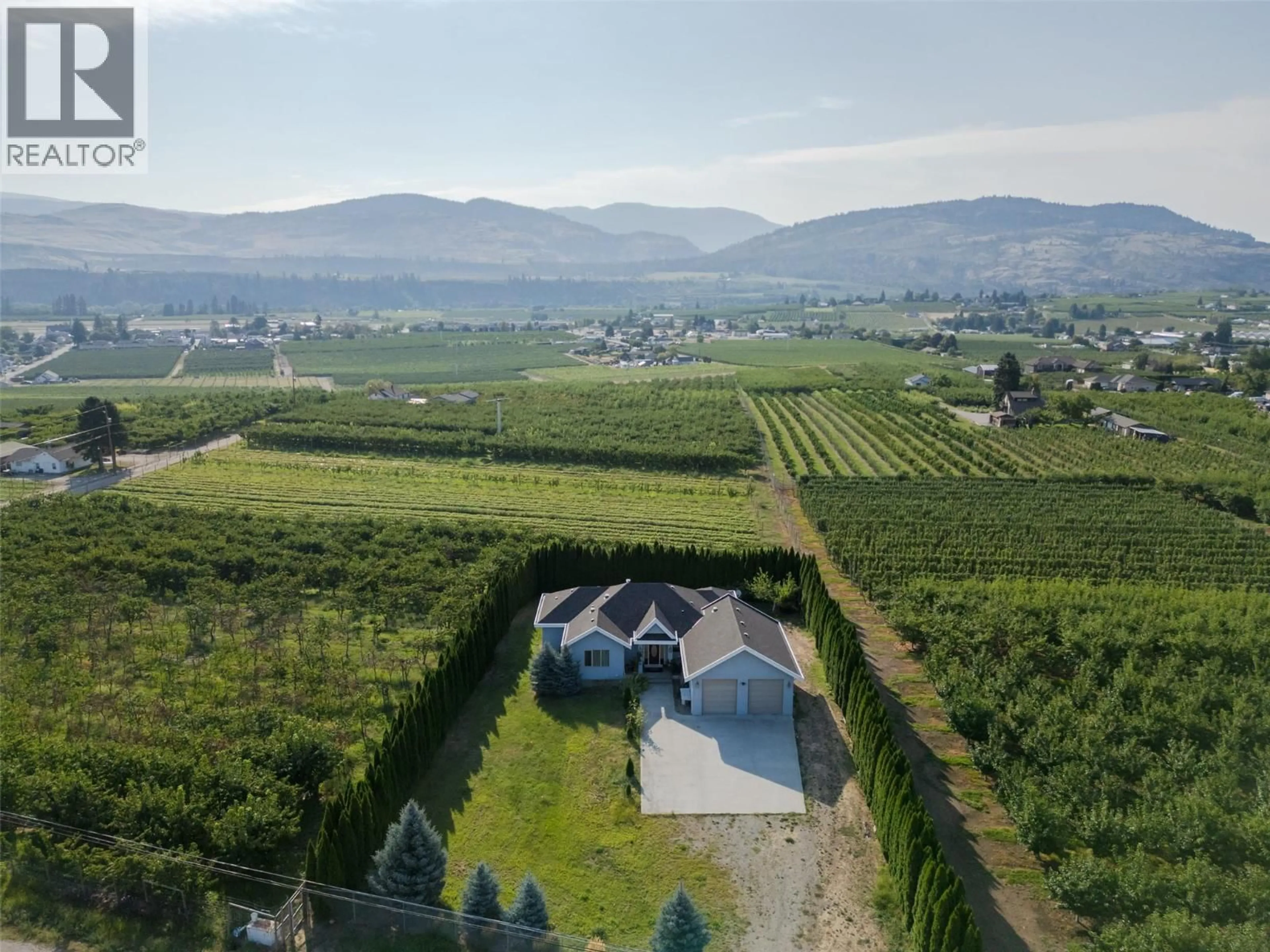 A pic from outside/outdoor area/front of a property/back of a property/a pic from drone, mountain view for 1095 FAIRVIEW ROAD, Oliver British Columbia V0H1T1