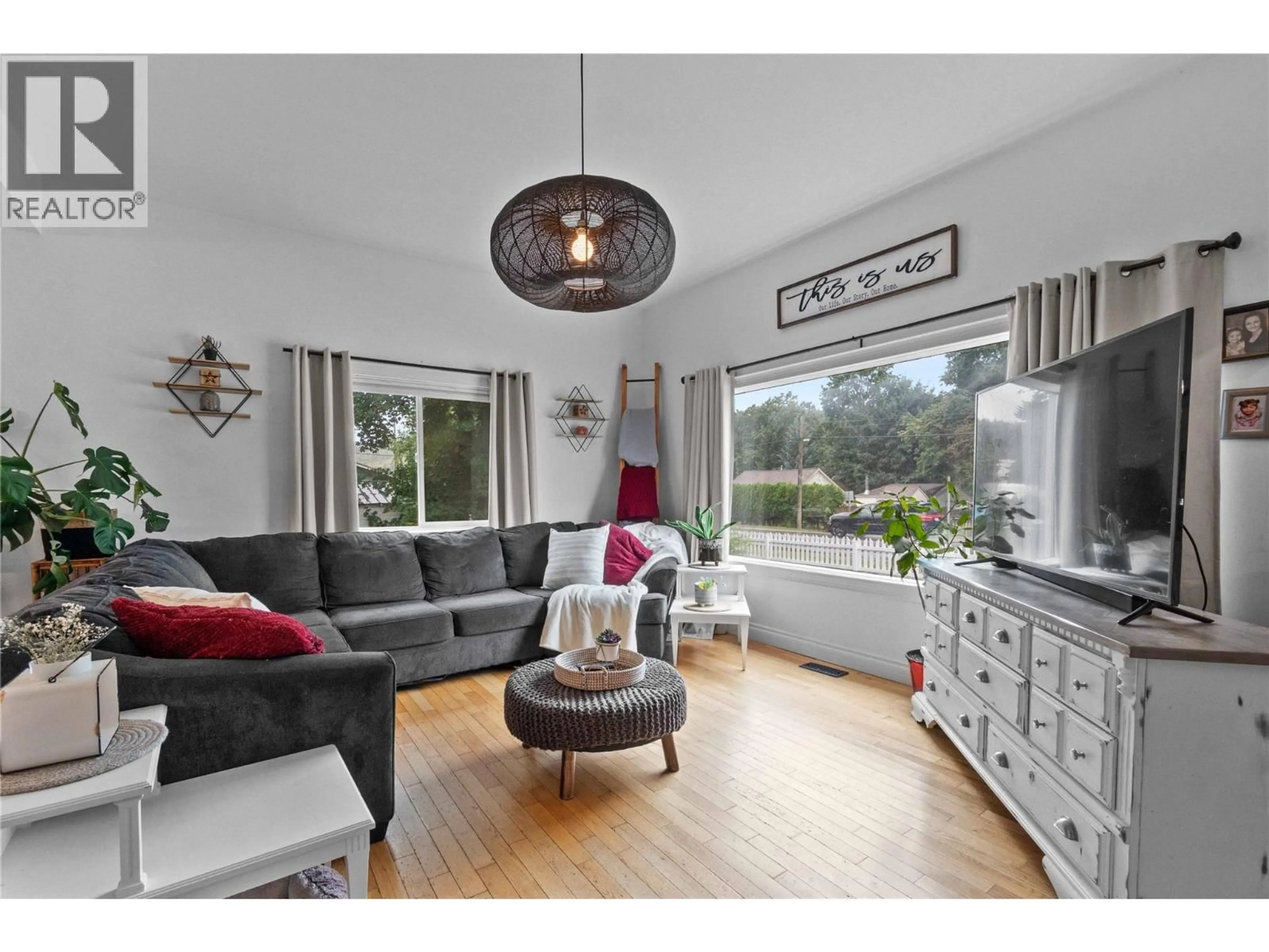 Living room with furniture, wood/laminate floor for 1207 GEORGE STREET, Enderby British Columbia V0E1V2
