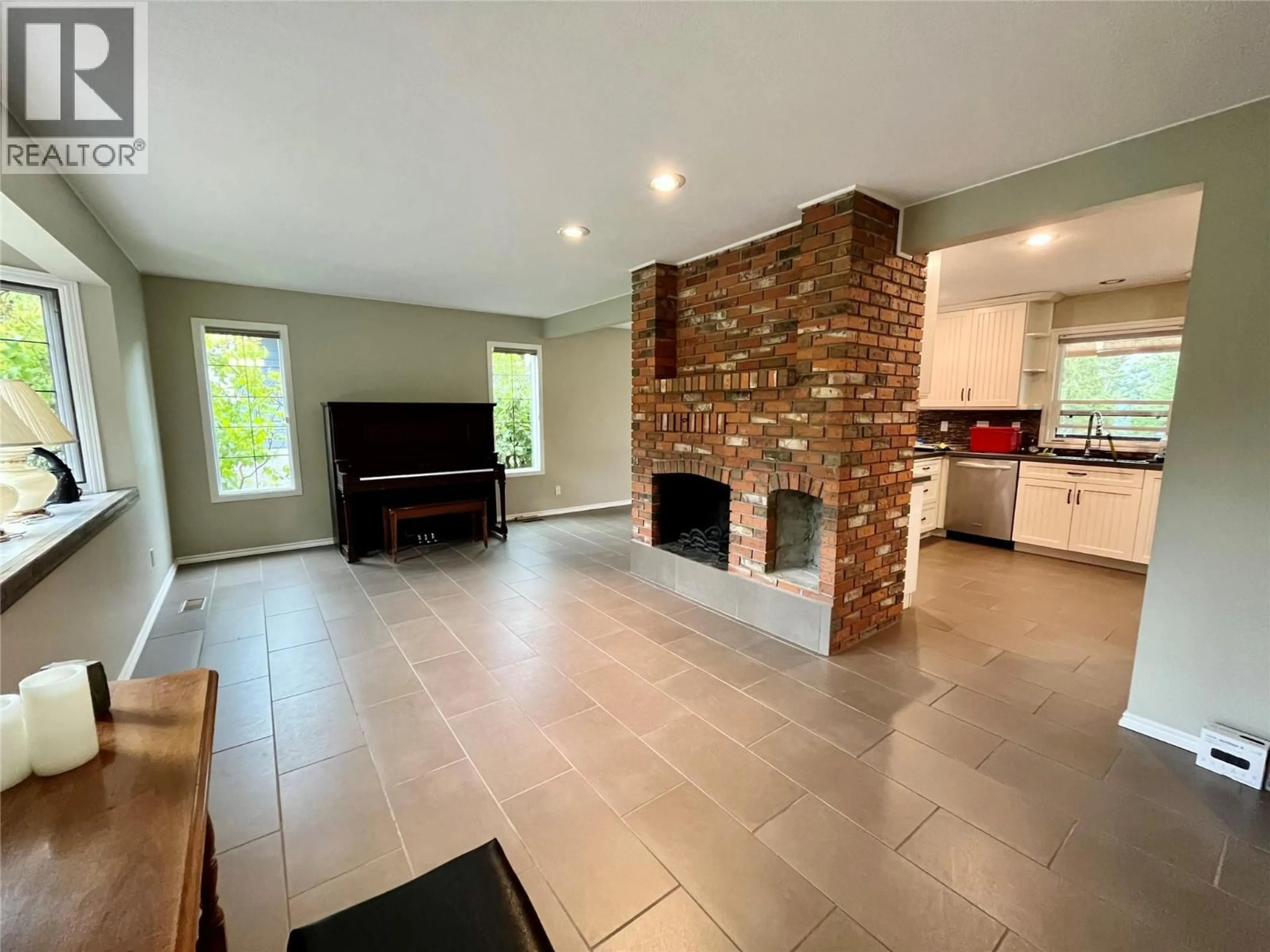 Open concept kitchen, ceramic/tile floor for 210 10TH AVENUE NORTHWEST, Nakusp British Columbia V0G1R0