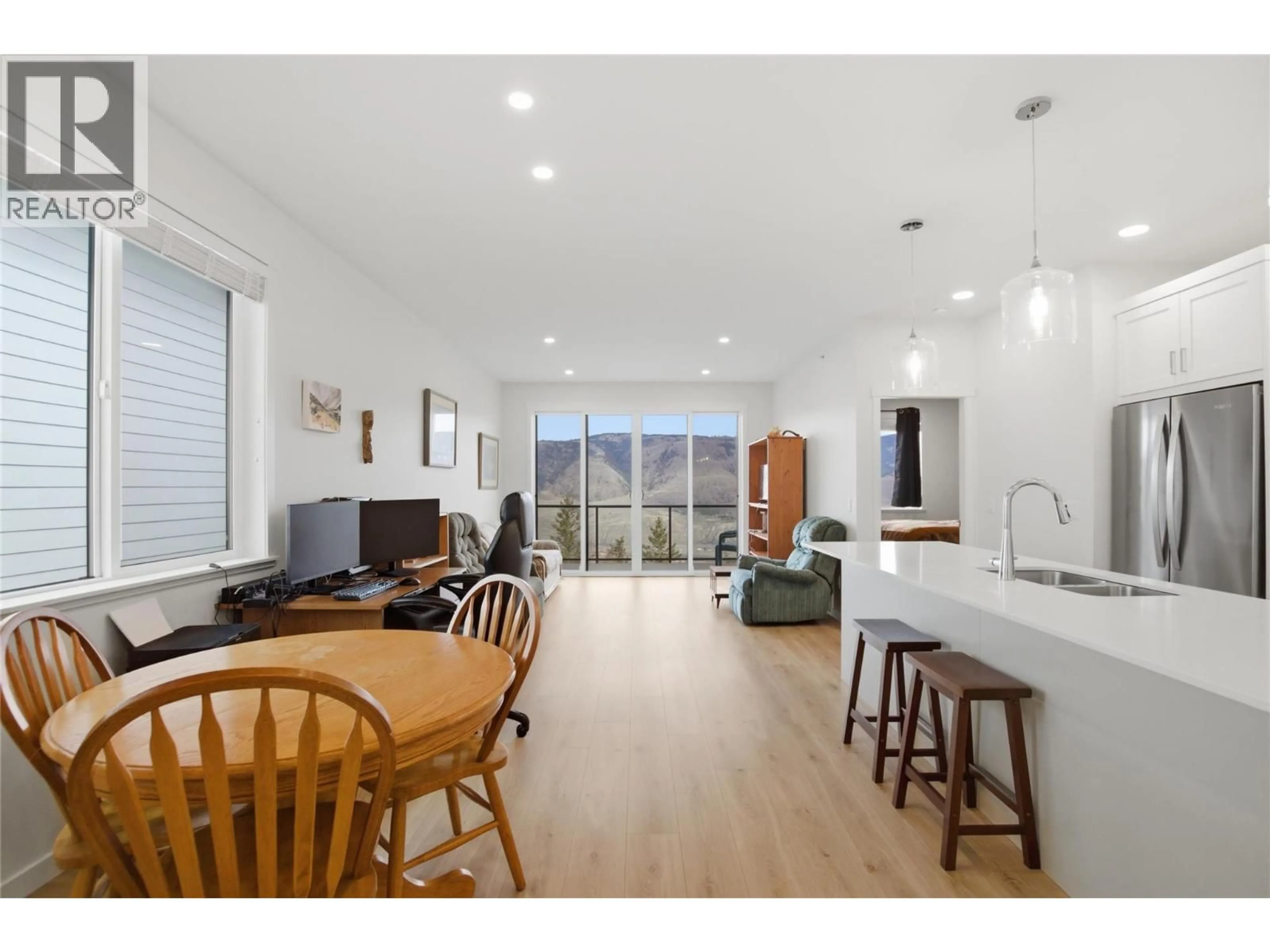 Open concept kitchen, wood/laminate floor for 114 - 1799 BABINE AVENUE, Kamloops British Columbia V2E0E3