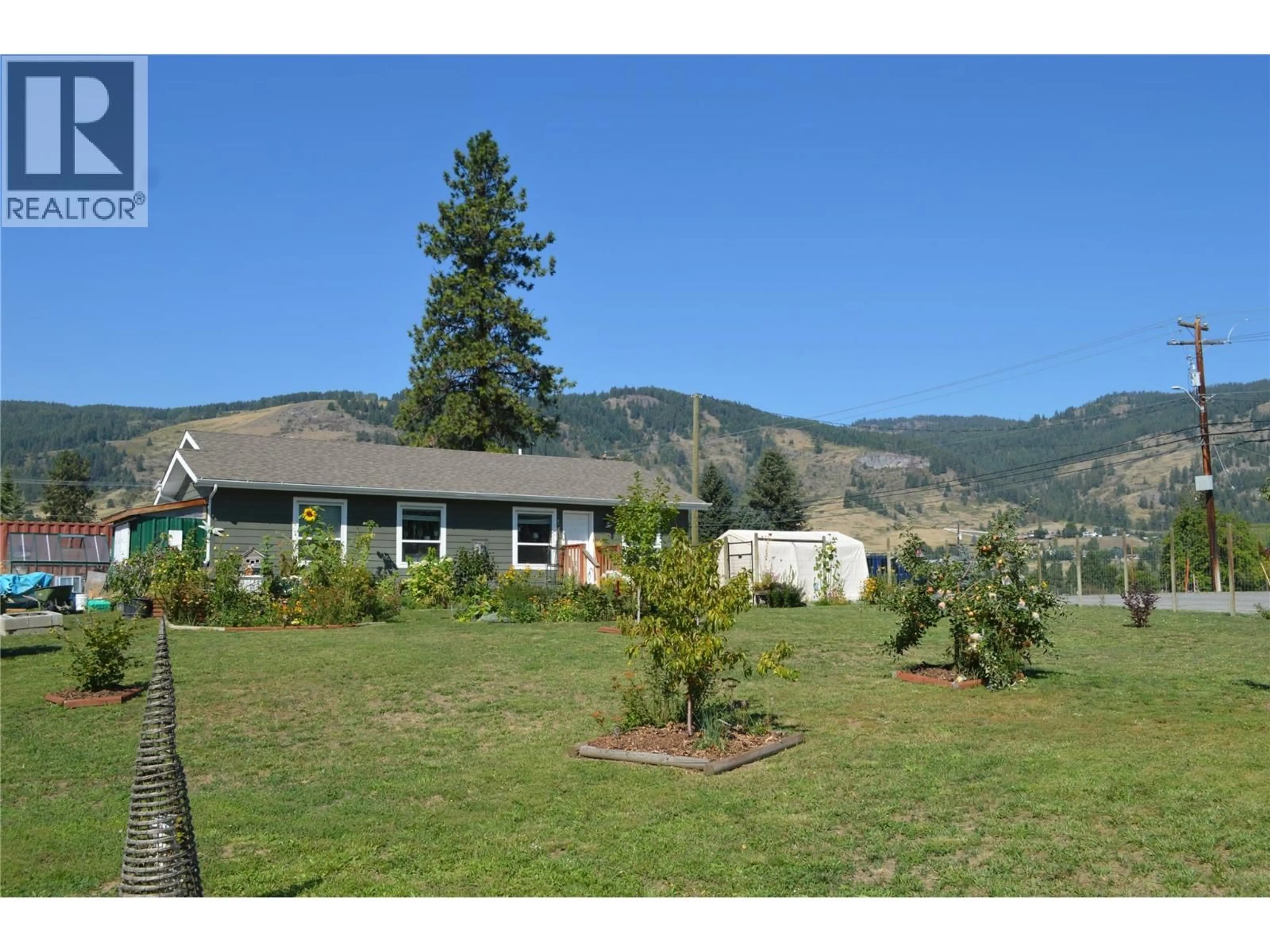 A pic from outside/outdoor area/front of a property/back of a property/a pic from drone, mountain view for 8187 DONALDSON DRIVE, Grand Forks British Columbia V0H1H2