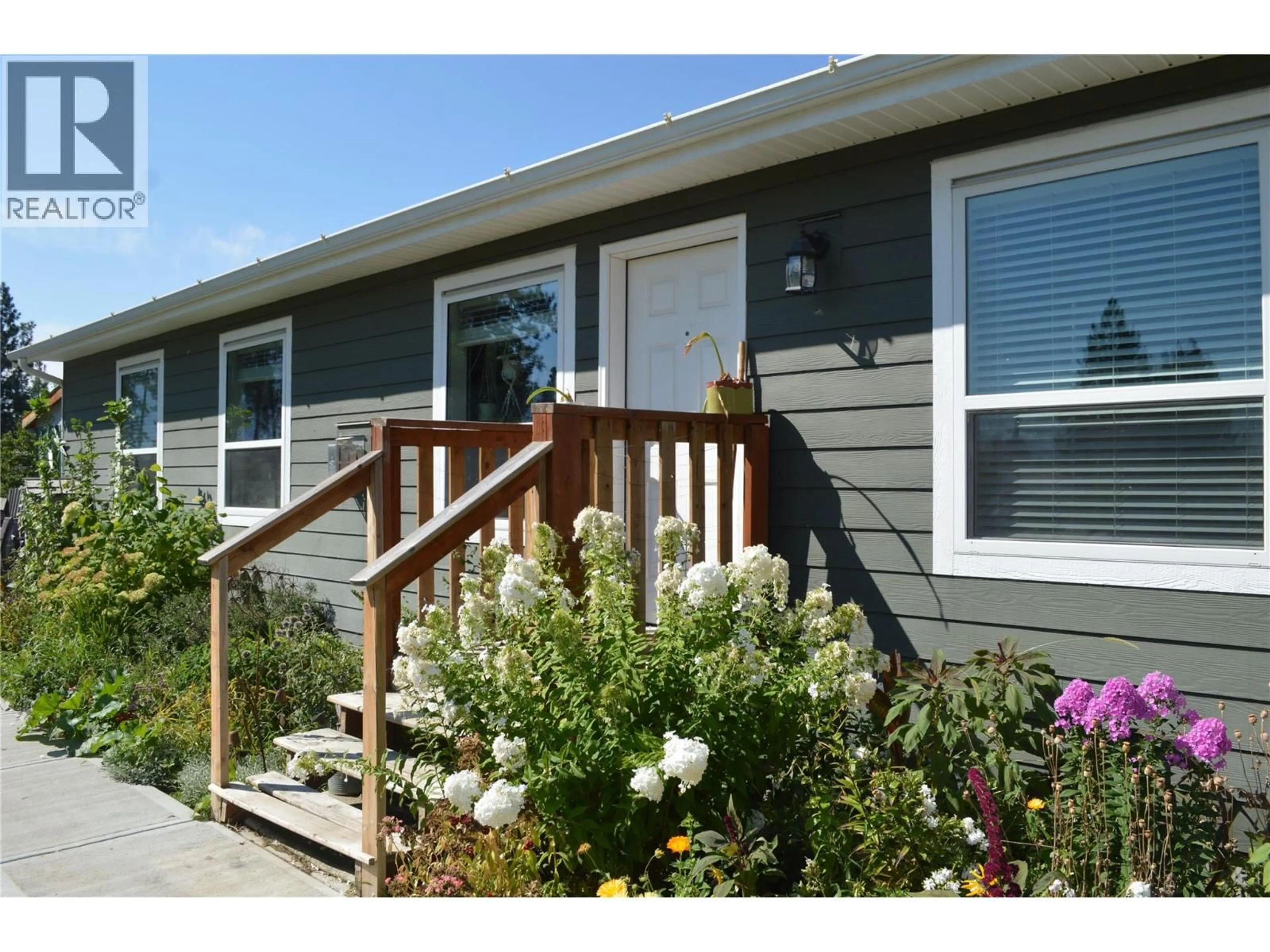 Home with vinyl exterior material, street for 8187 DONALDSON DRIVE, Grand Forks British Columbia V0H1H2