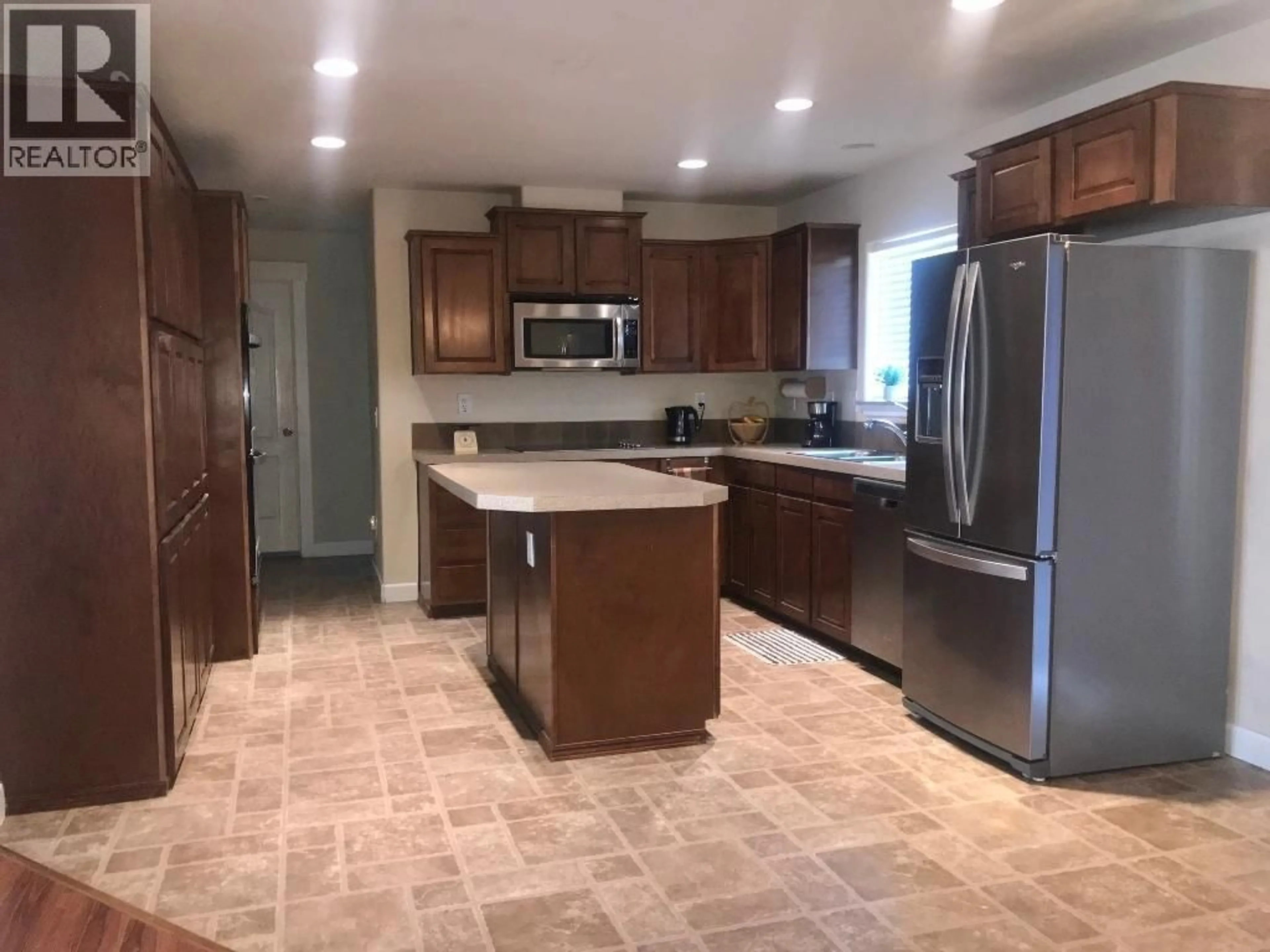 Open concept kitchen, ceramic/tile floor for 7357 10TH STREET, Grand Forks British Columbia V0H1H0