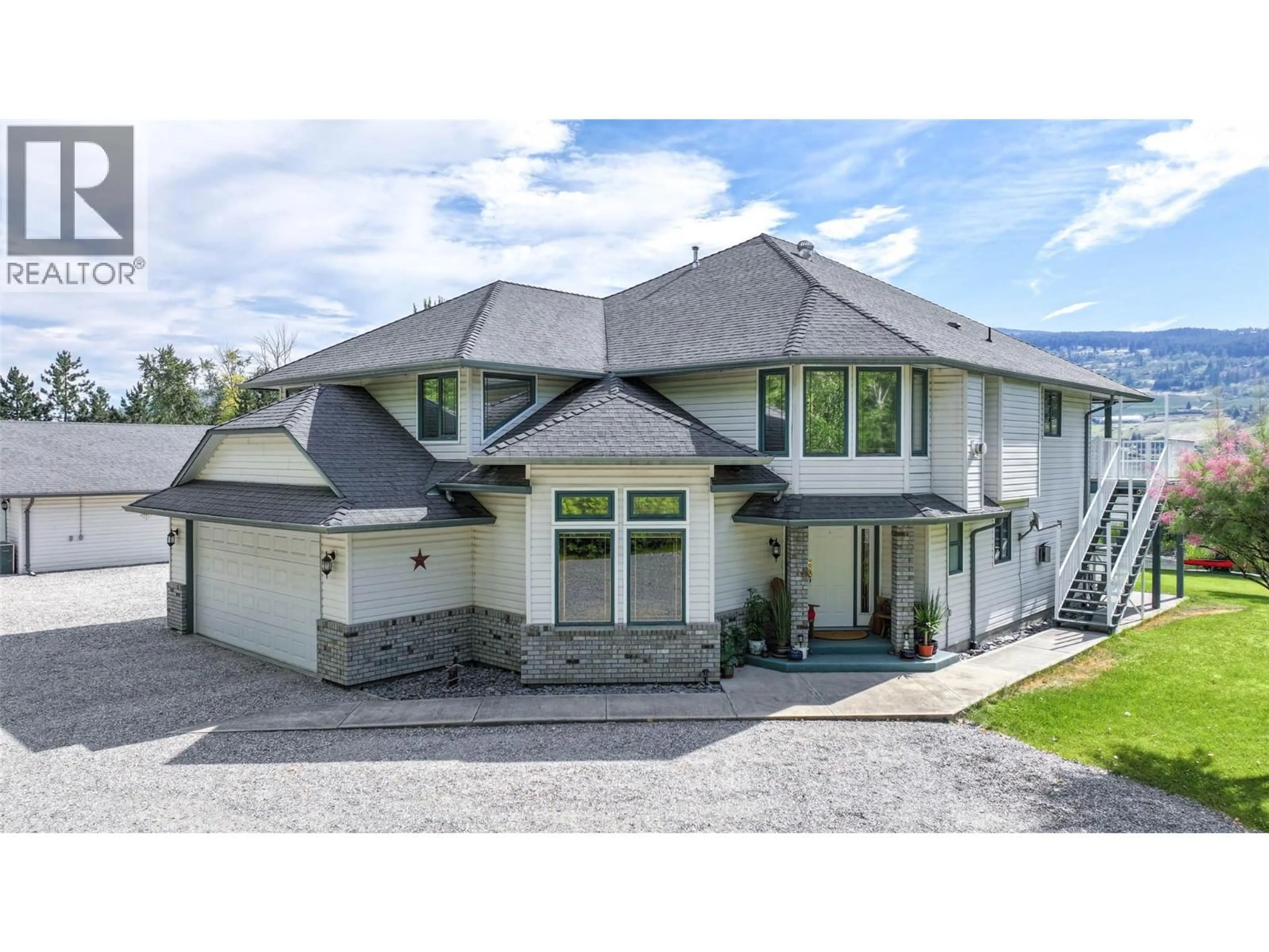 A pic from outside/outdoor area/front of a property/back of a property/a pic from drone, mountain view for 7821 OLD KAMLOOPS ROAD, Vernon British Columbia V1H1W8