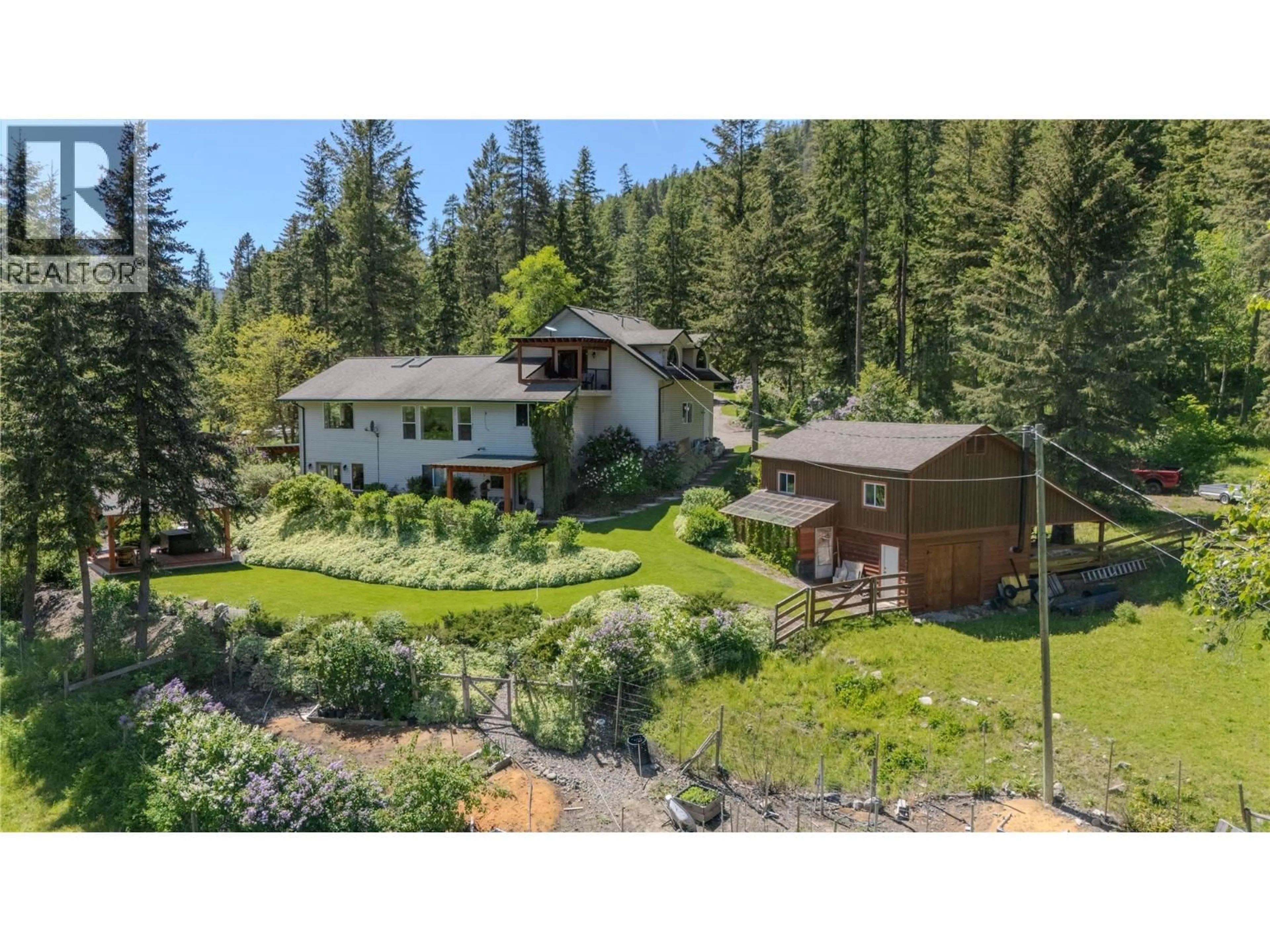 A pic from outside/outdoor area/front of a property/back of a property/a pic from drone, unknown for 157 HARRIS CREEK ROAD, Lumby British Columbia V0E2G1